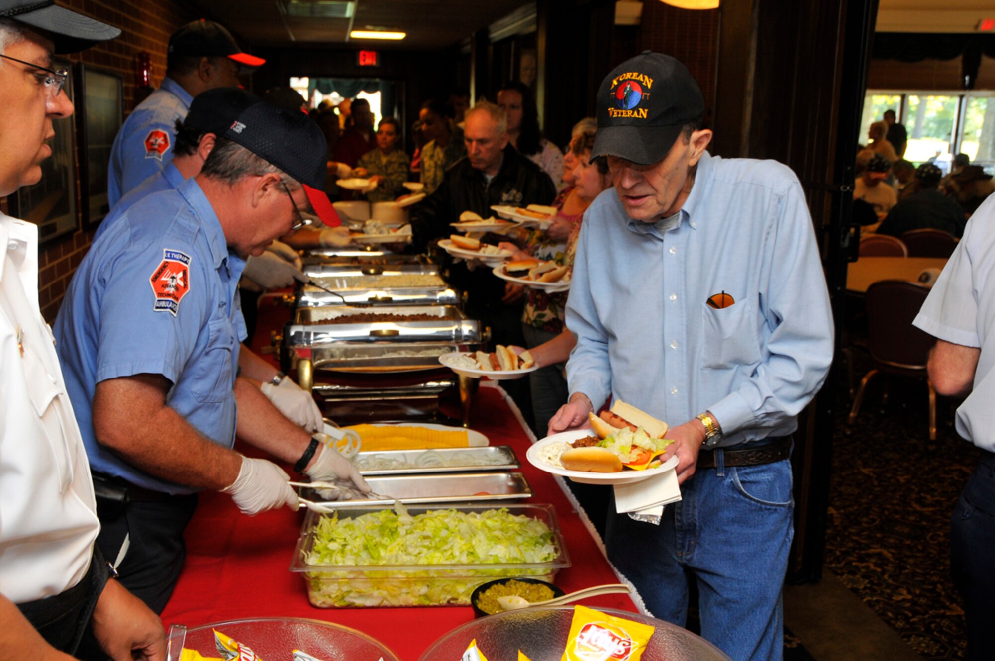 : Arnold AFB Firefighters serve lunch at the VA Picnic Oct. 6 at the Arnold Lakeside Center (ALC). (Photo by Rick Goodfriend)
