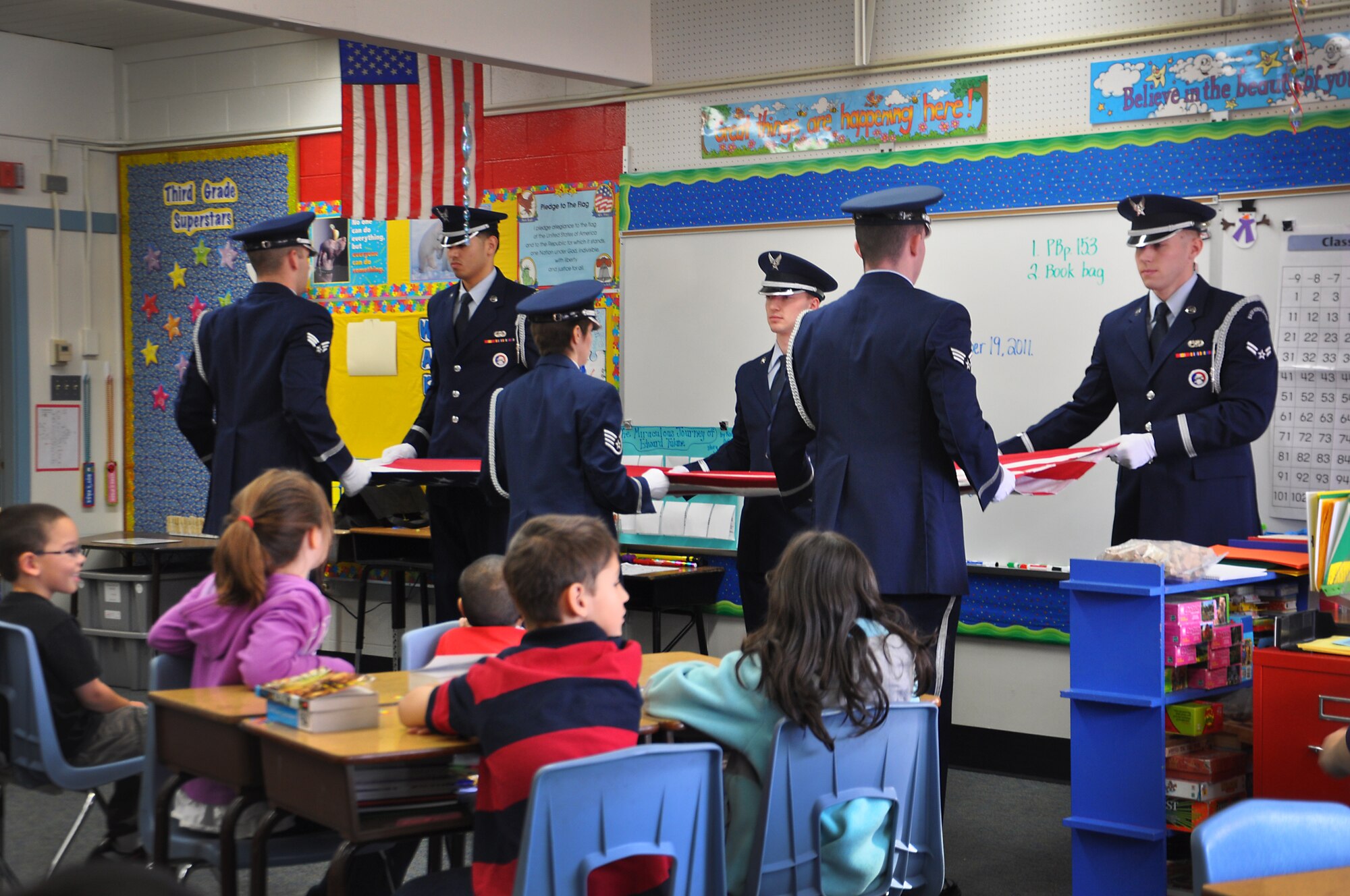 ANCHORAGE, Alaska -- Joint Base Elmendorf-Richardson honor guard members visited Abbott Loop Elementary school to demonstrate proper flag folding procedures as well as other military movements to students Oct. 19. (U.S. Air Force photo/Senior Airman Cynthia Spalding) 