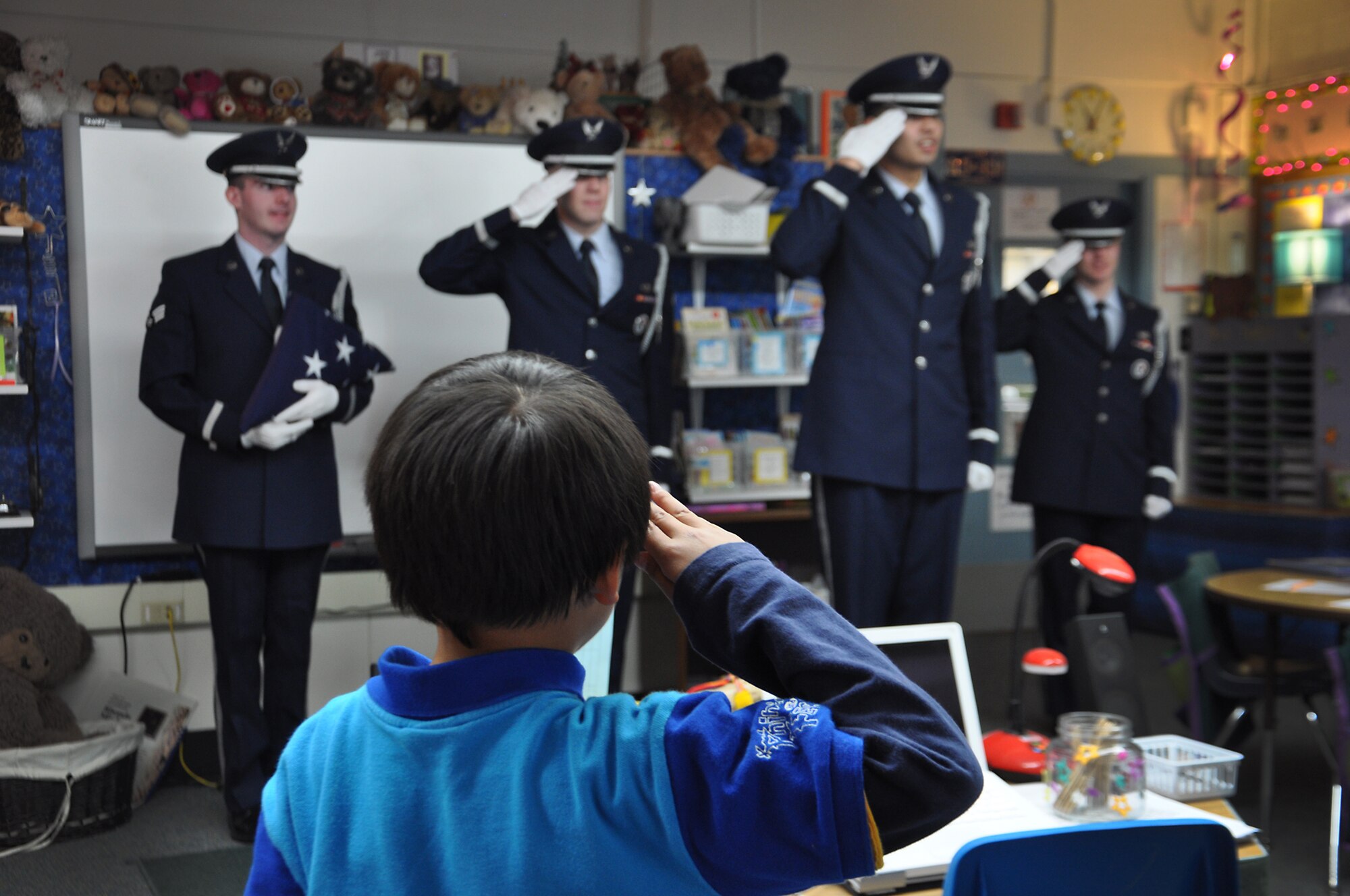ANCHORAGE, Alaska -- Joint Base Elmendorf-Richardson honor guard members visited Abbott Loop Elementary school to demonstrate proper flag folding procedures as well as other military movements to students Oct. 19. (U.S. Air Force photo/Senior Airman Cynthia Spalding) 