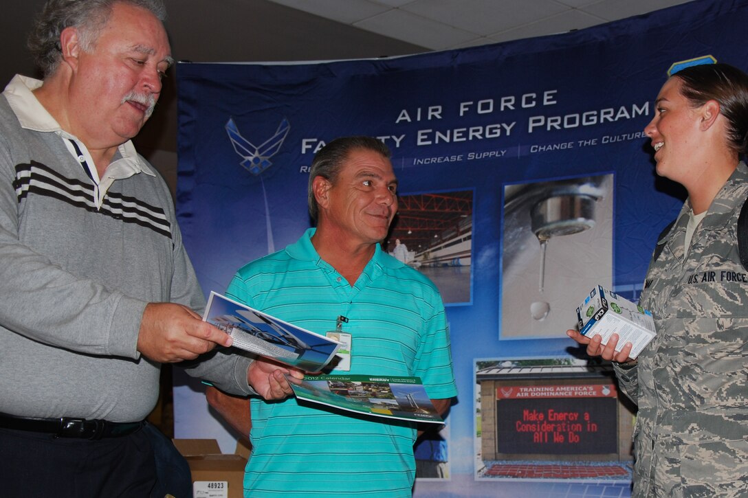 Mr. Glynn Batla, Resource Efficiency Manager, and Mr. Michael Gaffney, DS2 construction inspector, discuss energy savings through the use of Compact Fluorescent Light bulbs at Sheppard Air Force Base, Oct. 25. The 82nd Civil Engineering Squadron plans to distribute over 1,000 CFL bulbs to replace incandescent bulbs in housing and dormitories on base, a switch that will buy 75 percent energy savings. 