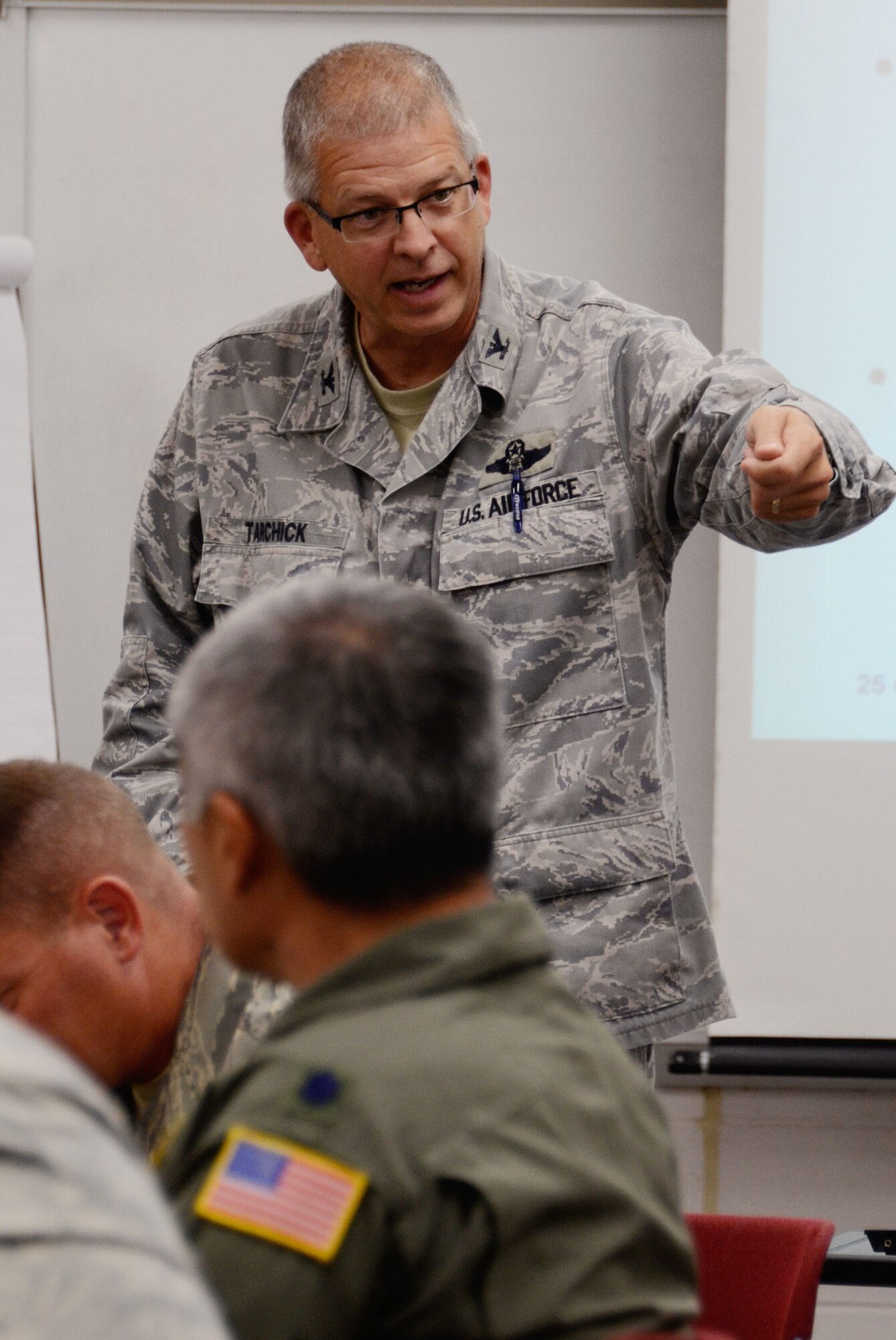 Col. Timothy E. Tarchick, 94th Airlift Wing commander provides feedback during an active shooter terrorist exercise scenario here Oct. 25. (U.S. Air Force photo/Don Peek)