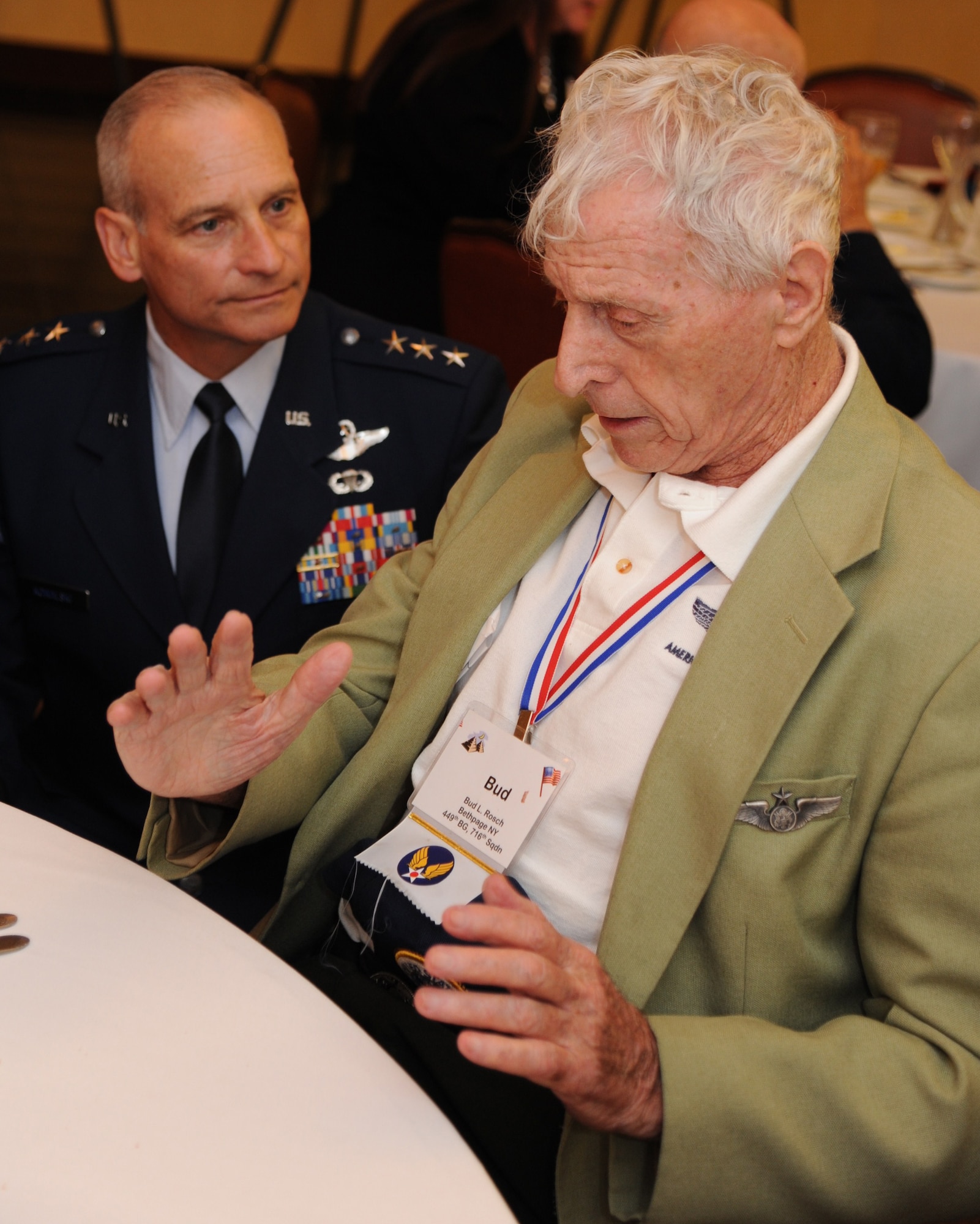 BARKSDALE AIR FORCE BASE, La. – Lt. Gen. Jim Kowalski, commander of Air Force Global Strike Command, listens to World War II veteran Staff Sgt. Bernard L. "Bud" Rosch describe a bombing mission during the 98th Bombardment Group/Wing Veterans Association reunion.  Rosch was a radio operator in the B-24 bomber for the Ploesti Raids in Romania from 1943-1944 and was honored during the reunion.  (U.S. Air Force photo/Master Sgt. Corey A. Clements)