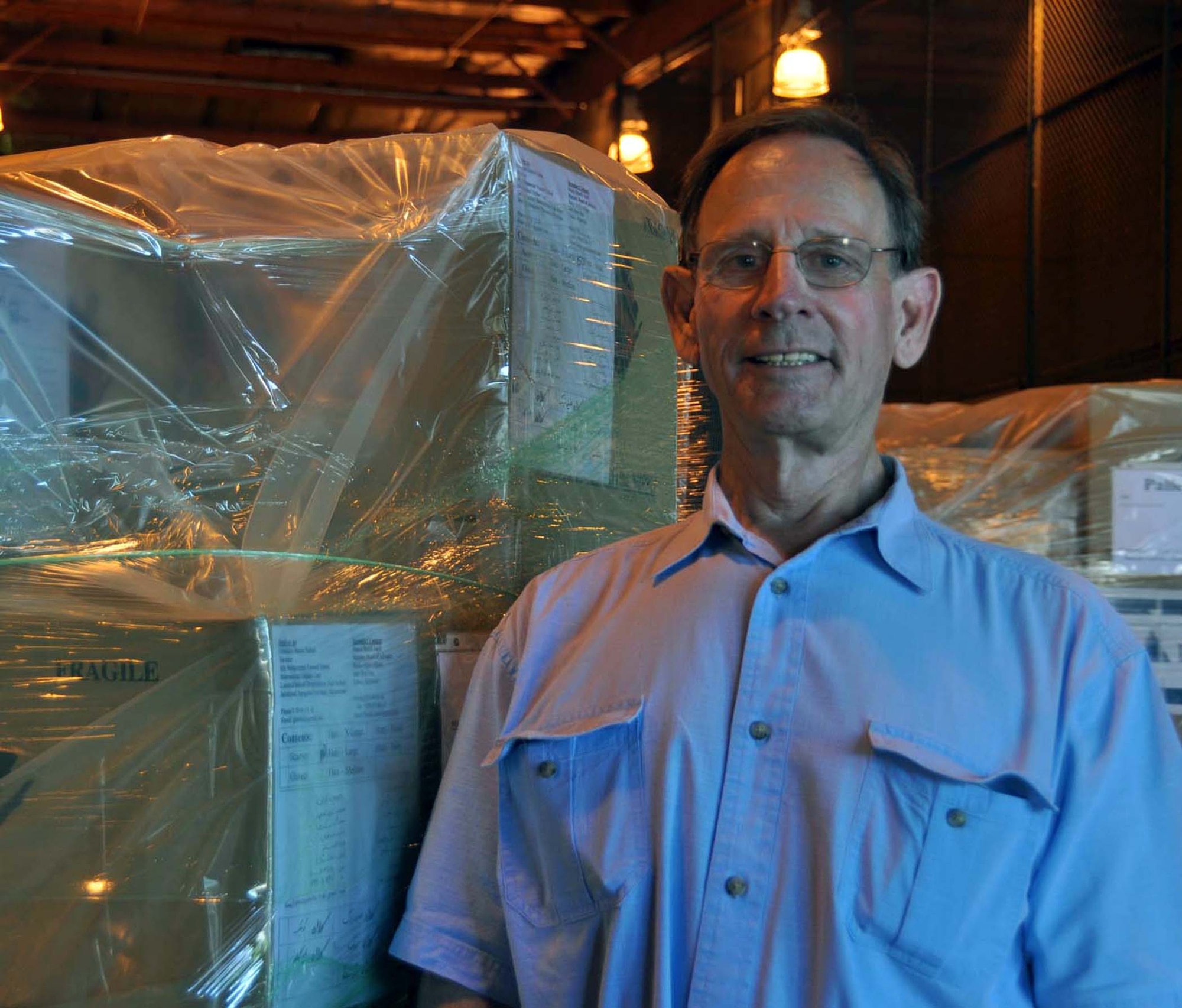 Mike Whipple of International Orphan Care, stands by humanitarian cargo September 28, 2011, being readied for shipment to Afghanistan as part of humanitarian cargo through the Denton Amendment, a U. S. government program that offers free shipment for this cargo via military aircraft on a space available basis.  The cargo, donated by Women of Faith in Redlands will be transported to the war-torn country by a 452nd Air Mobility Wing C-17 Globemaster III, where Whipple will arrive to receive it Octoer 4, and distribute it to local orpanages.  (U.S. Air Force photo/Linda Welz)