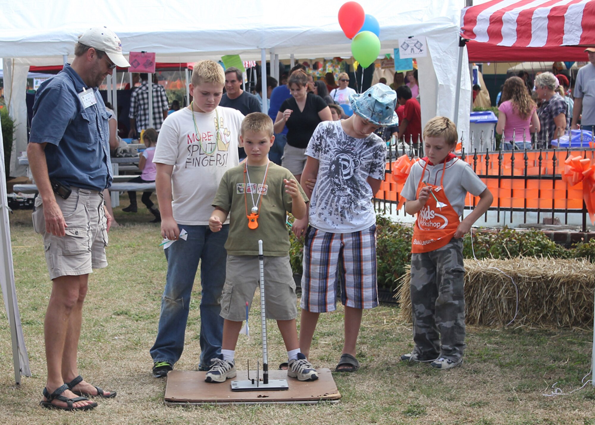 AEDC’s Mike Schleider watches as a student launches his rocket at the Polly Crockett Festival in Cowan. (Photo provided)
