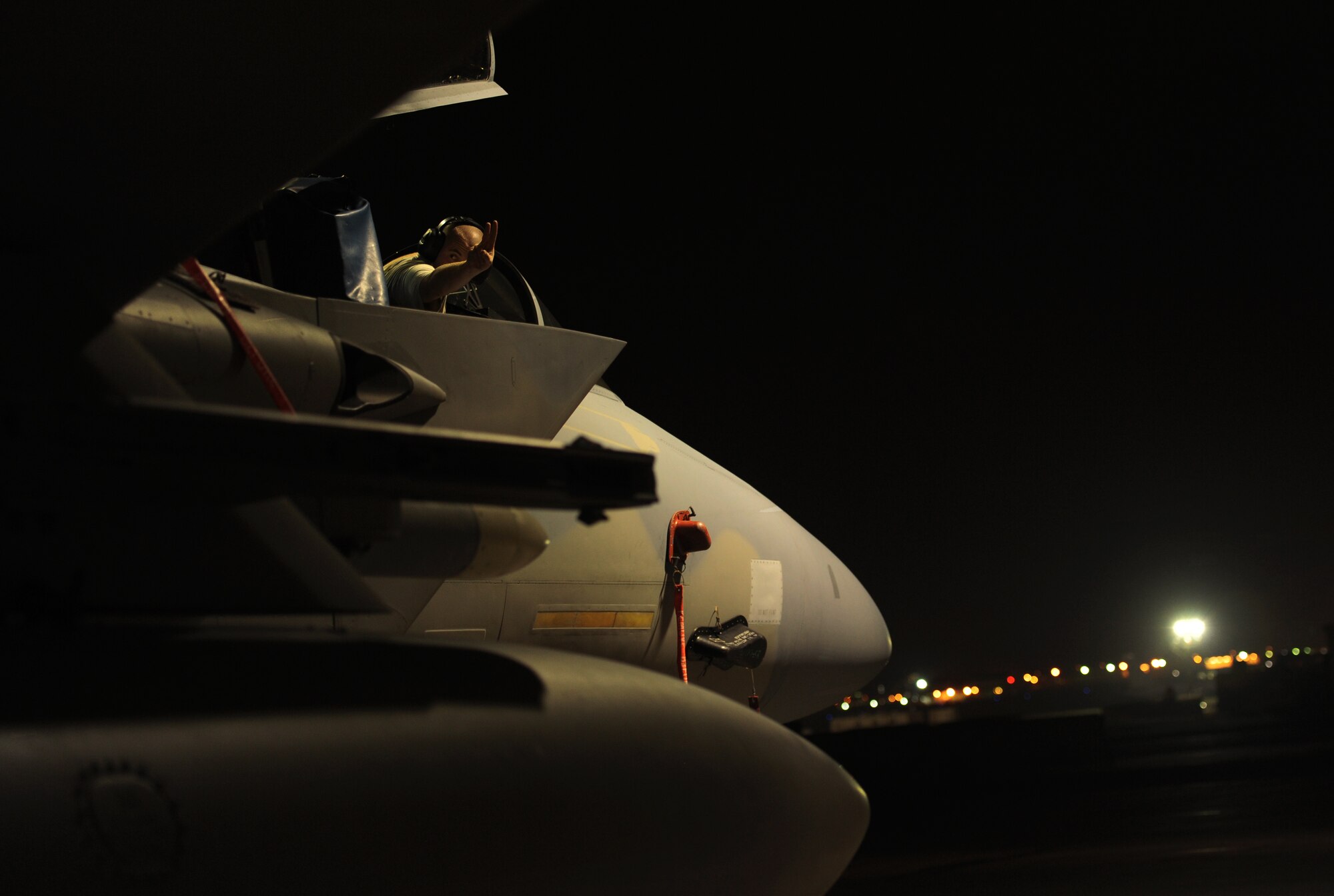 U.S. Air Force Staff Sgt. Daniel Ramey, 67th Fighter Squadron avionics specialist, signals while checking the fuel test indicator on a F-15 during local operational readiness exercise Beverly High 12-1 at Kadena Air Base, Japan, Oct. 25. The exercise tested the Wing's ability to deploy and receive forces as well as generate sorties. (US Air Force photo/Airman 1st Class Jarvie Z. Wallace)
