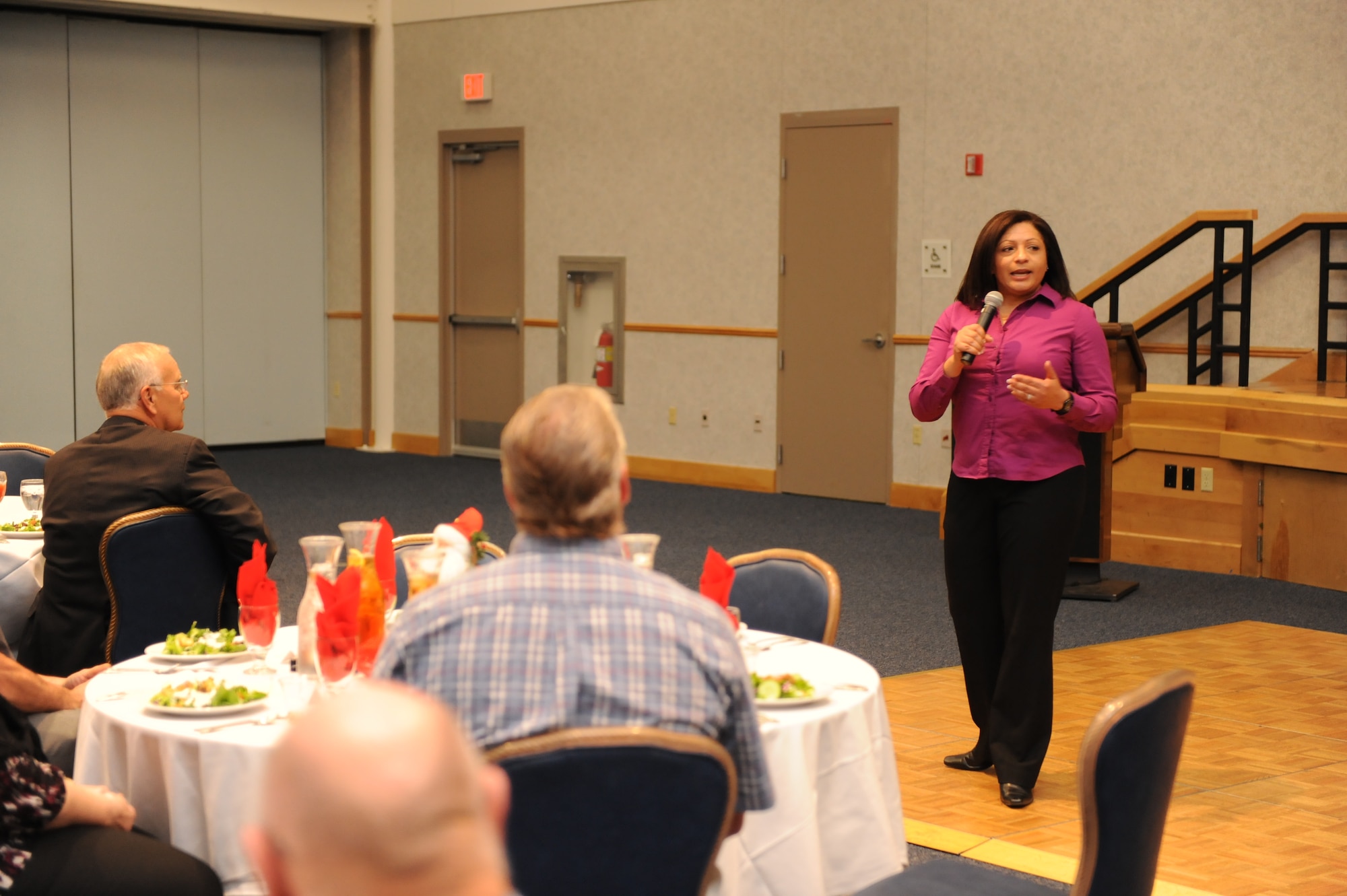 Lt. Col. Wendy Bos, 22nd Mission Support Group deputy commander and retiree active duty liaison officer, speaks during Retiree Appreciation Day at the Robert J. Dole Community Center ballroom, McConnell Air Force base, Kan., Oct. 22, 2011.  The scheduled events, which included medical testing , dinner and a performing band, showed McConnell’s gratitude for veterans and their service.   (U.S. Air Force photo/ Airman 1st Class Maurice Hodges)