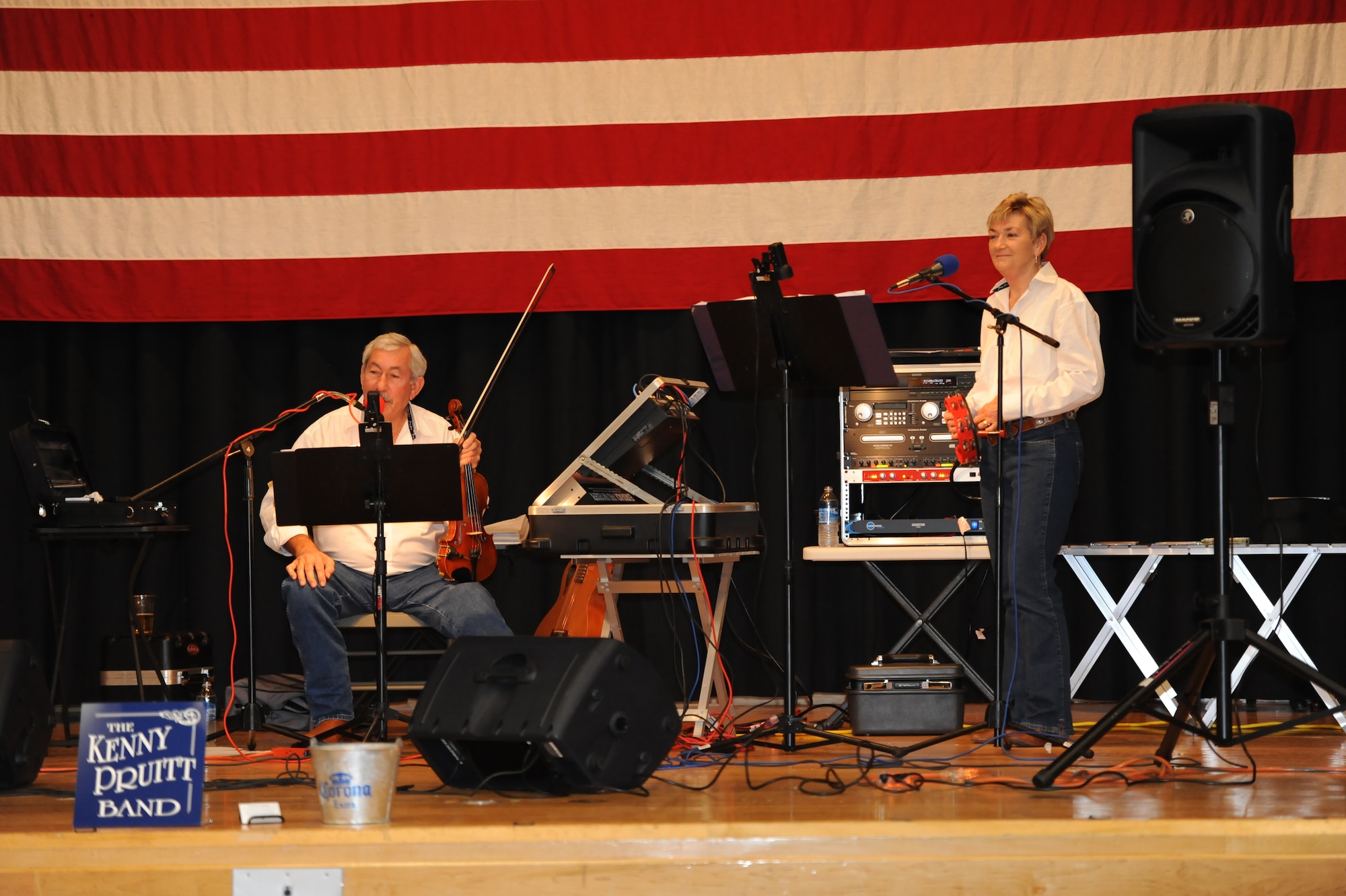 Kenny Pruitt and Rosa Pruitt, a husband and wife from the Kenny Pruitt band, perform during Retiree Appreciation Day at the Robert J. Dole Community Center ballroom Oct. 22, 2011, McConnell Air Force Base, Kan.  The day included medical testing and dinner for retirees.  The annual event displayed McConnell’s gratitude for veterans and hosted approximately 140 retirees from all branches of the military.  (U.S. Air Force photo/ Airman 1st Class Maurice Hodges)