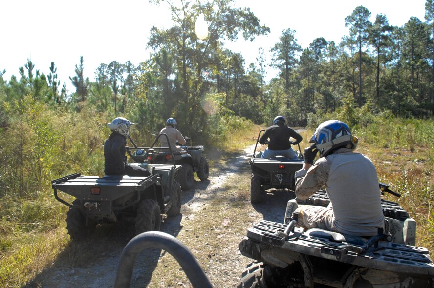 Aircrew flight equipment Airmen from the 38th Rescue Squadron take a quick break before resuming their four-wheeler refresher course Oct. 21, 2011, at Moody Air Force Base, Ga. In addition to four-wheelers, members are also trained on six-wheeled all-terrain vehicles, forklifts and Jet Skis. (U.S. Air Force photo by Senior Airman Brigitte N. Brantley/Released)