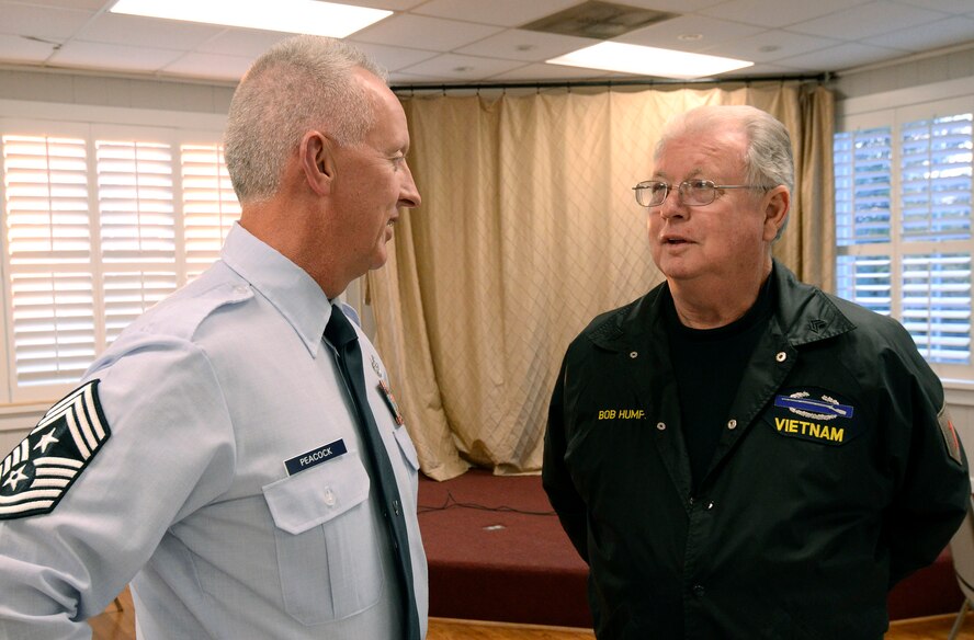 Chief Master Sgt. Wendell Peacock, Command Chief for the 94th Airlift Wing at Dobbins Air Reserve Base, talks with veteran Bob Humphries, vice president of the Georgia Vietnam Veterans Alliance, chapter one,  in Marietta, Ga., Oct. 20. The Marietta Chapter of the alliance is dedicated to provide quality services and support to veterans to help with their self-esteem and encourage them to be self reliant.   (U.S. Air Force photo/ Brad Fallin)