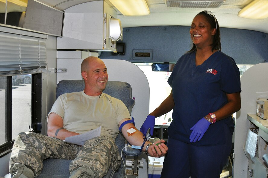 The 908th Airlift Wing recently hosted a blood drive for LifeSouth Community Blood Centers, Inc. Staff Sgt. Charles Anders jokes with a LifeSouth blood technician. (Air Force photo by Staff Sgt. Sandi Percival)