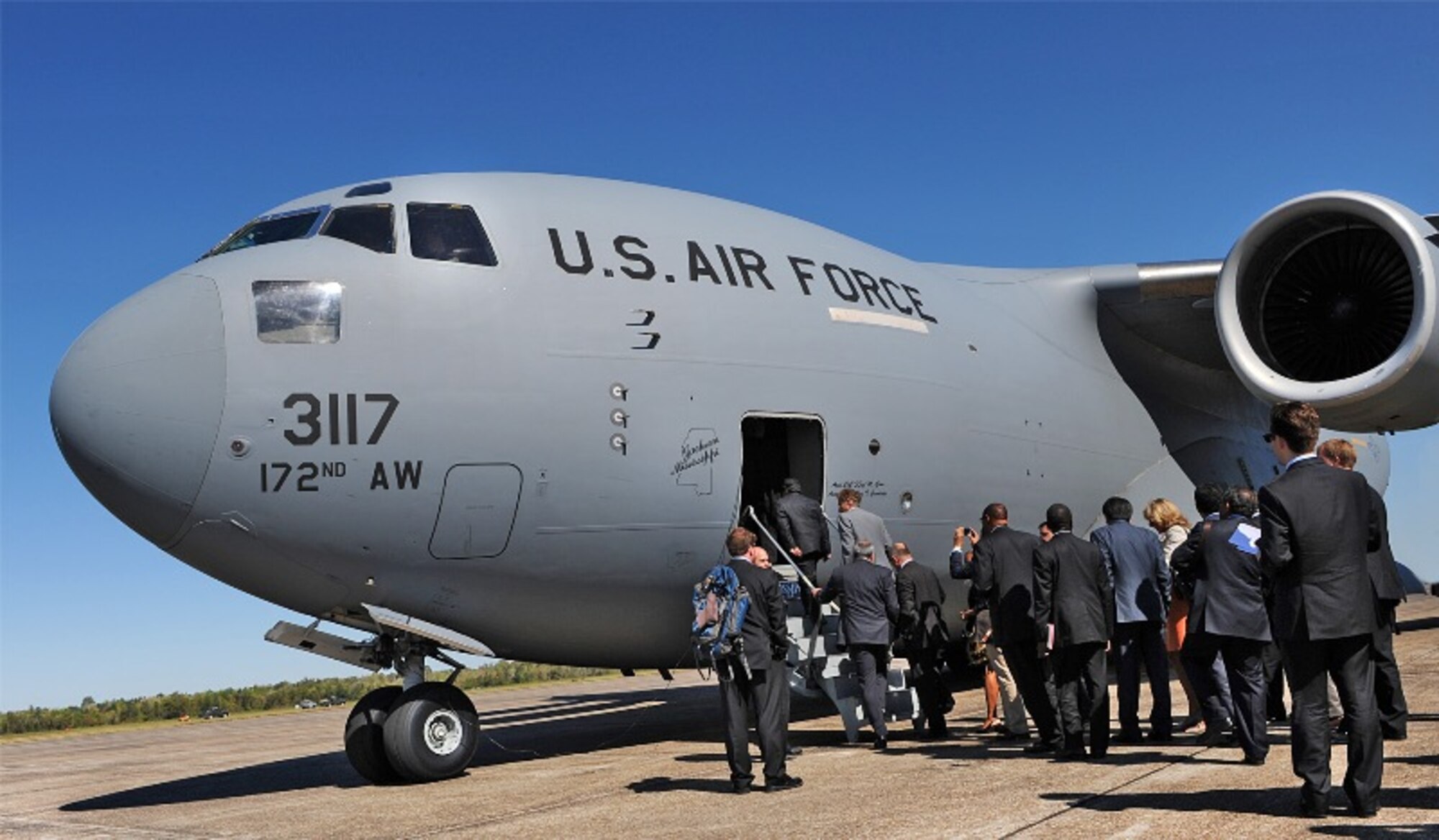 BELLE CHASSE, La. - As guests of the 159th Fighter Wing, Louisiana Air National Guard, foreign ambassadors with the Experience America program board a 172nd Airlift Wing, Mississippi Air National Guard C-17 Globemaster III at NAS-JRB New Orleans, La., Oct. 21, 2011.  On the last day of a three-day tour, the ambassadors were given an aerial tour of areas that were affected by hurricanes and an oil spill in recent years.  (U.S. Air Force photo by Master Sgt. Dan Farrell, 159th Fighter Wing Public Affairs Office/Released)