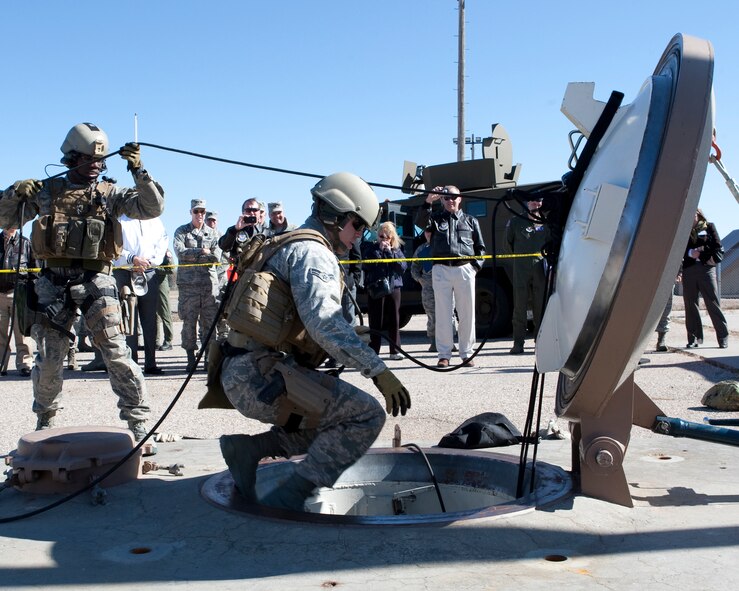 Members of the 90th Security Force Group perform a demonstration for members of the Air Force Chief of Staff Civic Leader Program tour held on F. E. Warren Air Force Base, Wyo., Oct. 20. The Air Force Chief of Staff Civic Leader Program is comprised of respected community leaders selected from the Air Force major commands, National Guard Bureau and Headquarters Air Force. The Air Force Civic Leaders are unpaid advisors who serve as a civilian interface between the Air Force and the civilian community. (U.S. Air Force photo by Matt Bilden)