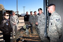 Staff Sgt. Bryan Kovalik and Staff Sgt. Ryan Wyskochil, both with the 90th Security Force Group, brief members of the Air Force Chief of Staff Civic Leader Program as Col. John Wilcox, 90th SFG commander, looks on during the Air Force Chief of Staff Civic Leader Program Oct. 20. The Air Force Chief of Staff Civic Leader Program is comprised of respected community leaders selected from the Air Force major commands, National Guard Bureau and Headquarters Air Force. The Air Force Civic Leaders are unpaid advisors who serve as a civilian interface between the Air Force and the civilian community. (U.S. Air Force photo by Matt Bilden)