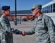 Col. John Wilcox, 90th Security Force Group commander, greets Lt. Gen. Richard Newton, Air Force Assistant Vice Chief of Staff, during the Air Force Chief of Staff Civic Leader Program tour of F. E. Warren Air Force Base, Wyo. The Air Force Chief of Staff Civic Leader Program is comprised of respected community leaders selected from the Air Force major commands, National Guard Bureau and Headquarters Air Force. The Air Force Civic Leaders are unpaid advisors who serve as a civilian interface between the Air Force and the civilian community. (U.S. Air Force photo by Matt Bilden)
