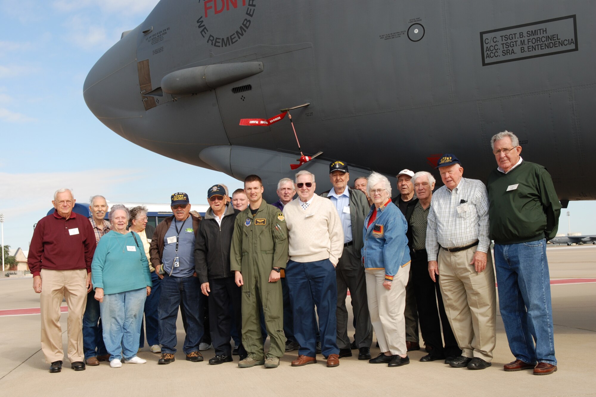 Former members of the 1095th Special Weapons Squadron pose for a photo with 1st Lt. Daniel Bevers, 11th Bomb Squadron, after being briefed on the capabilities of the B-52 Stratofortress at Barksdale Air Force Base, La., Oct. 21, 2011. The group was part of a 1095th SWS reunion on a base tour, which also included an A-10 Thunderbolt II static, a visit to the 8th Air Force museum, and lunch at the Barksdale Club. (U.S. Air Force photo by Betty Stephens) 