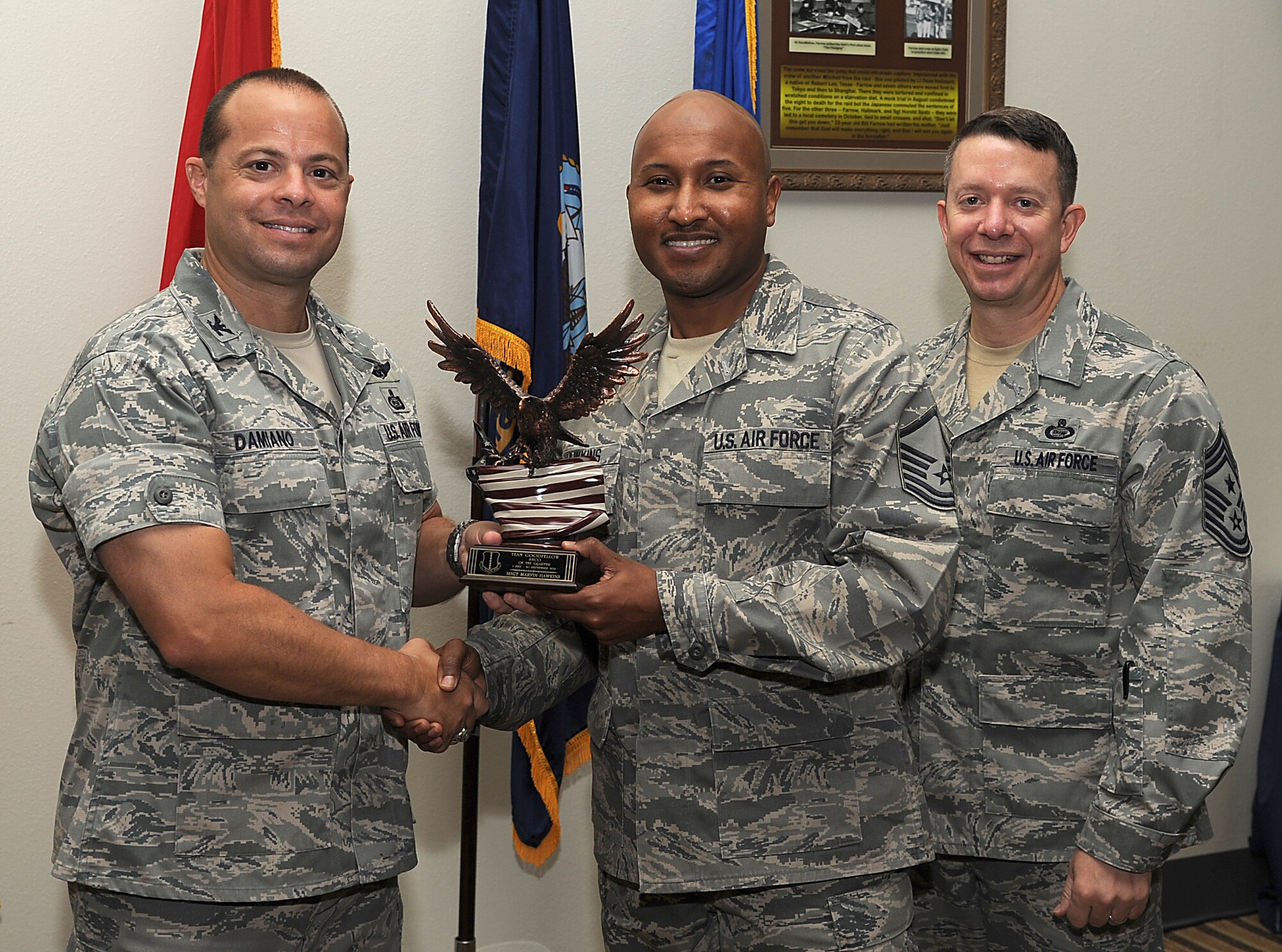 GOODFELLOW AIR FORCE BASE, Texas -- Col. Mark Damiano, 17th Training Wing Commander, and Chief Master Sgt. Brendan Criswell, 17th TRW Command Chief, present Master Sgt. Marvin Hawkins, 17th Medical Group, with the Team Goodfellow Senior NCO of the Quarter Award for the third quarter.  (U.S. Air Force photo/Airman 1st Class Michael Smith)