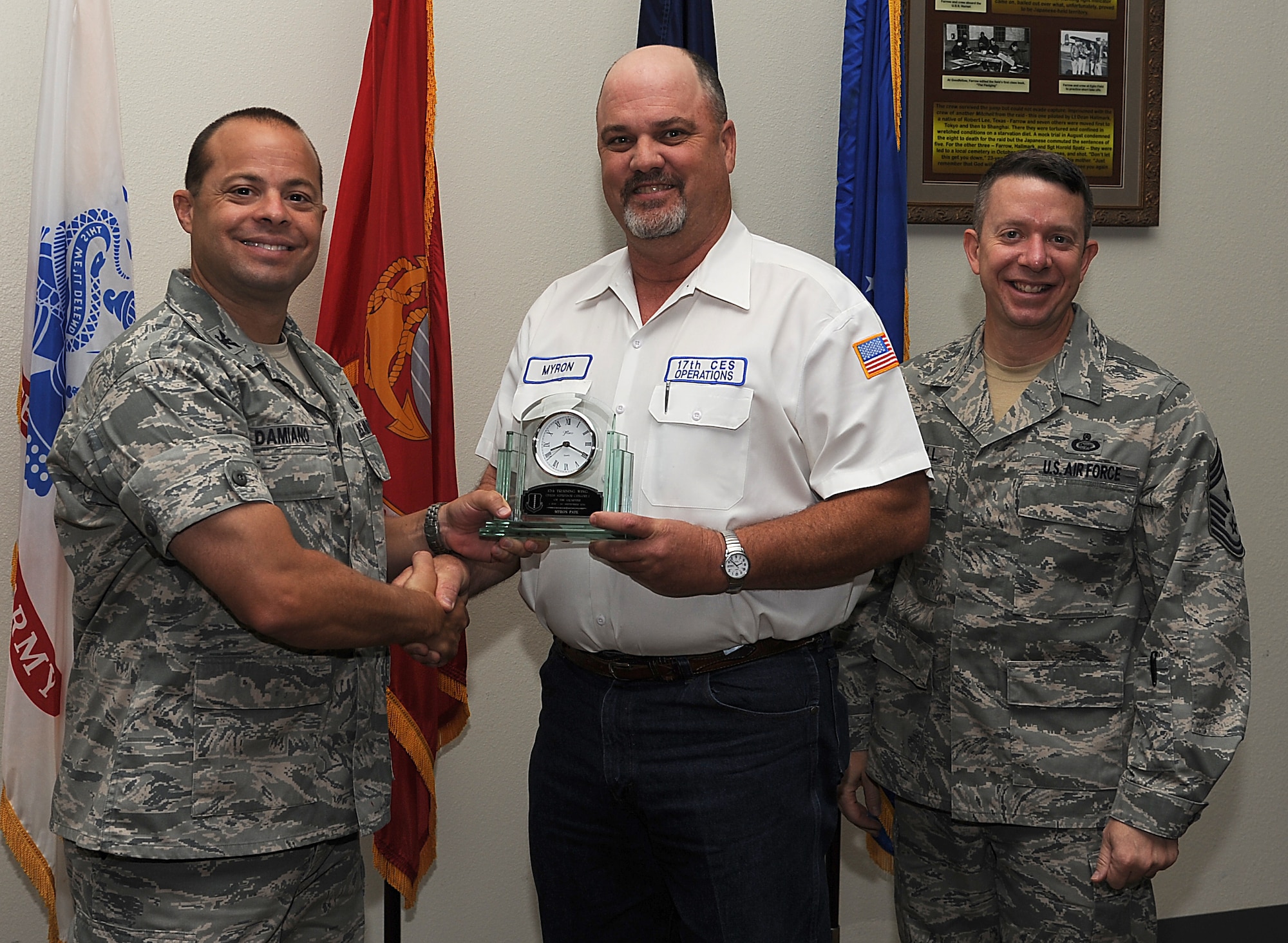 GOODFELLOW AIR FORCE BASE, Texas -- Col. Mark Damiano, 17th Training Wing Commander, and Chief Master Sgt. Brendan Criswell, 17th TRW Command Chief, present Myron Pate, 17th Mission Support Group, with the 17th TRW Civilian Supervisor Category I of the Quarter Award for the third quarter. (U.S. Air Force photo/Airman 1st Class Michael Smith)