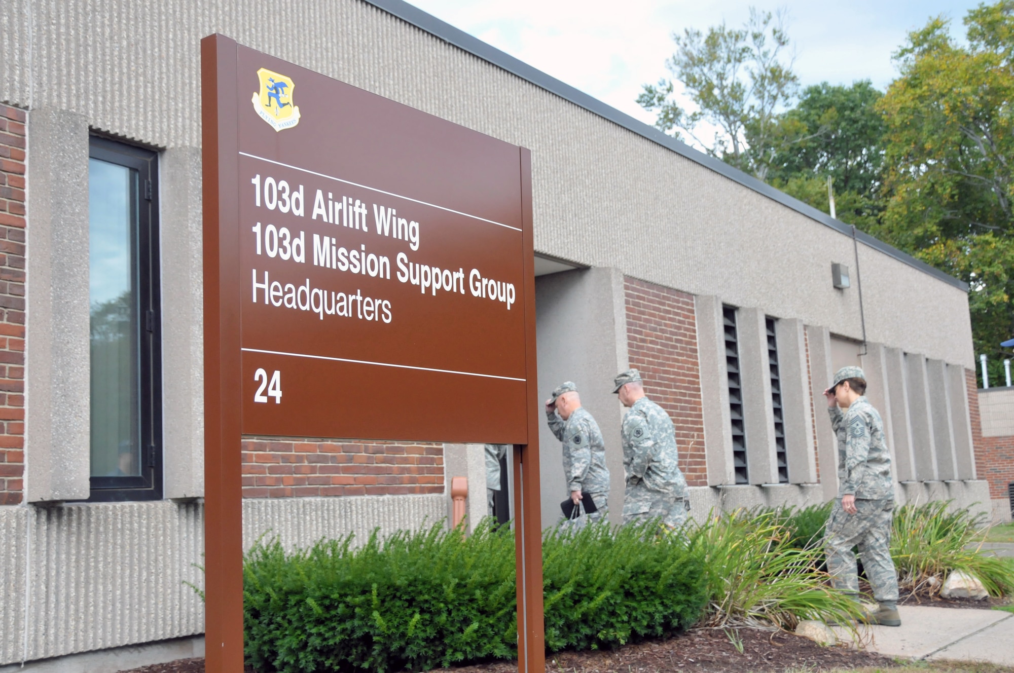 Members of the Senior Enlisted Advisory Council and their 103rd Airlift Wing escorts arrive at wing headquarters to discuss with enlisted Airmen current issues during a town-hall meeting. The council visited the Bradley Air National Guard Base, East Granby, Conn. Oct. 5, 2011, as part of their quarterly meeting where they get together to discuss current enlisted issues facing the Armed Forces. (U.S. Air Force photo by Tech. Sgt. Joshua Mead)