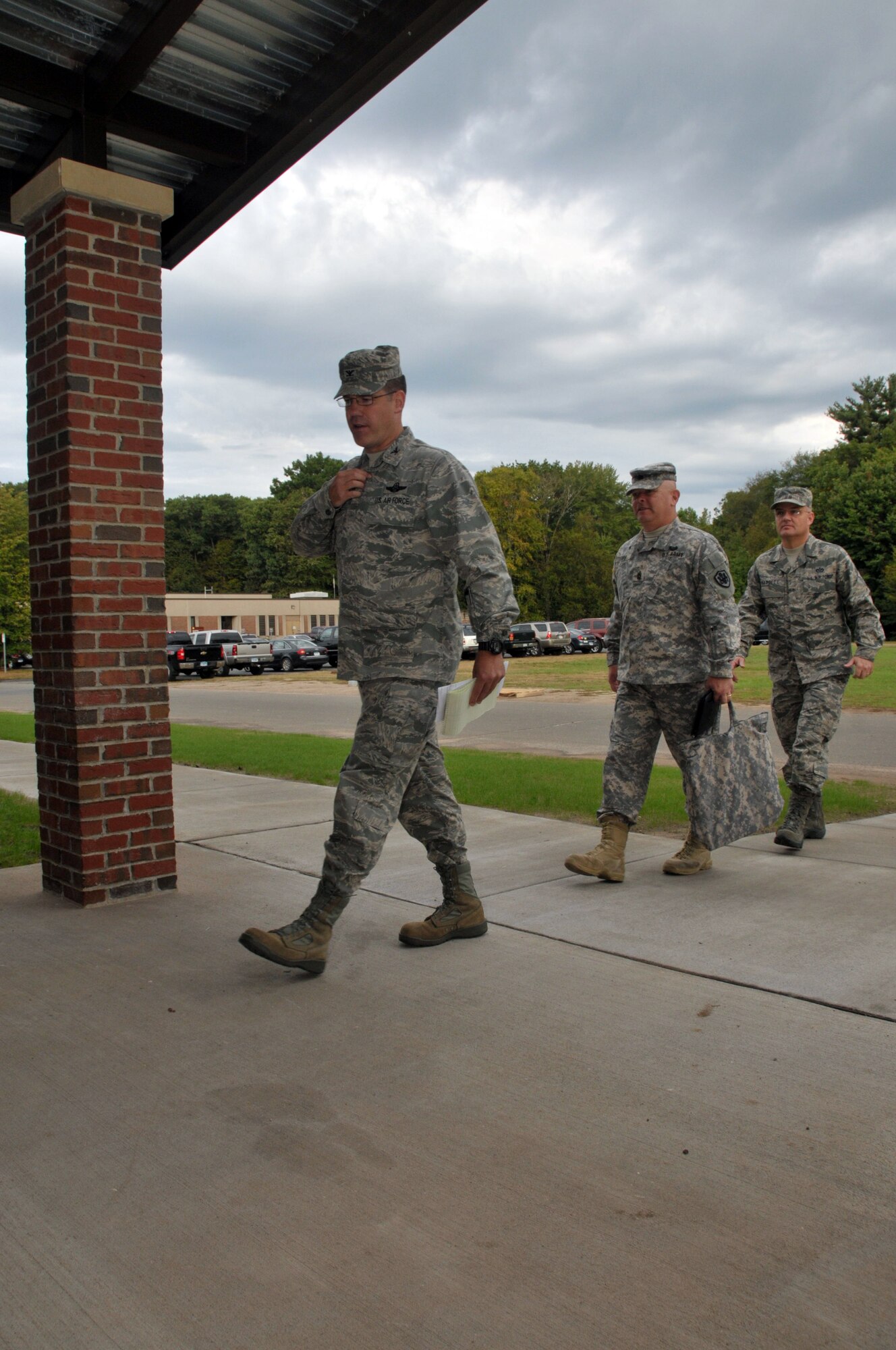 Col. Peter J. DePatie, commander, 103rd Air and Space Operations Group, leads the Senior Enlisted Advisory Council into a newly-constructed AOG facility during the SEAC’s visit to Bradley Air National Guard Base, East Granby, Conn. Oct. 5, 2011. Pictured following Col. DePatie are Command Sgt. Maj. John D. Gipe, senior enlisted advisor to the secretary of defense (Reserve Affairs) and Chief Master Sgt. Dale Badgett, command chief for the Air Force Reserve Command. (U.S. Air Force photo by Tech. Sgt. Joshua Mead)