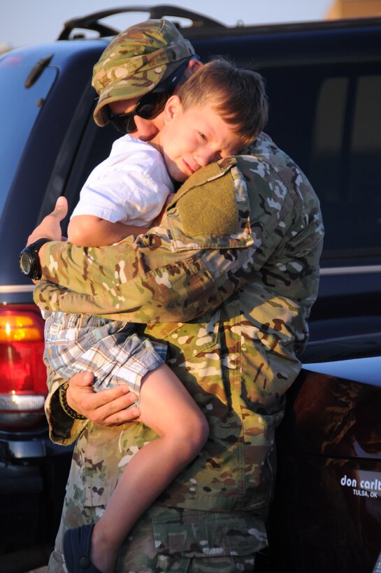 U.S. Air Force Tech Sgt Brandon White, assigned to the 146th Air Support Operations Squadron, says goodbye to his son Gannon before leaving for Afghanistan on Will Rogers Air National Guard base, 11 July, 2011. As a joint terminal attack controller, White will be working alongside the Oklahoma Army Guard providing air support in hostile environments. 
(U.S. Air Force Photo by Staff Sgt Caroline Hayworth/Released)