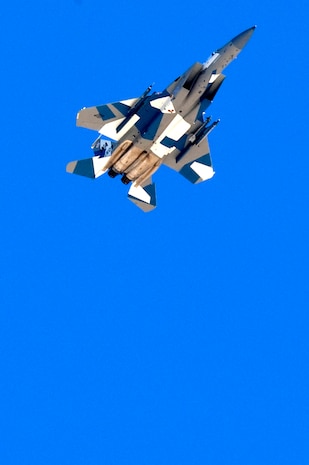 U.S. Air Force Capt. David Vincent, 65th Aggressor Squadron pilot, flies an F-15 Eagle with an updated "Splinter" paint scheme Oct. 20, 2011, at Nellis Air Force Base, Nev.  The updated Russian paint scheme promotes realistic threat replication when participating in simulated air to air combat.  (U.S. Air Force photo by Staff Sgt. William P.Coleman/Released)
