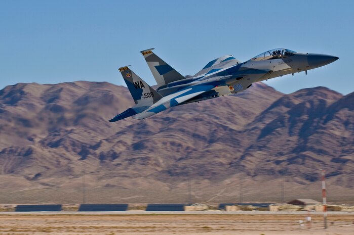 U.S. Air Force Capt. David Vincent, 65th Aggressor Squadron pilot, flies an F-15 Eagle with an updated "Splinter" paint scheme Oct. 20, 2011, at Nellis Air Force Base, Nev. The updated Russian paint scheme promotes realistic threat replication when participating in simulated air to air combat.  (U.S. Air Force photo by Staff Sgt. William P.Coleman/Released)
  

