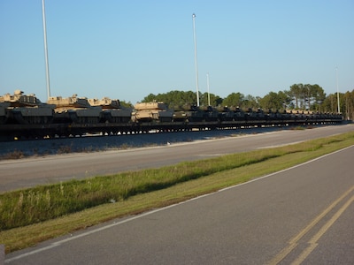 Track vehicles loaded onto await transportation from Joint Base Charleston - Weapons Station Oct. 21. The 841st Transportation Battalion, which is responsible for moving re-deploying cargo that is off-loaded at JB Charleston, loaded 44 track vehicles onto 22 railcars for shipment to multiple locations across the United States.The 841st is a subordinate unit of the Military Surface Deployment and Distribution Command and conducts surface deployment distribution and water terminal operations along the Atlantic Seaboard. (U.S. Army photo/Maj. Scott Hammond)