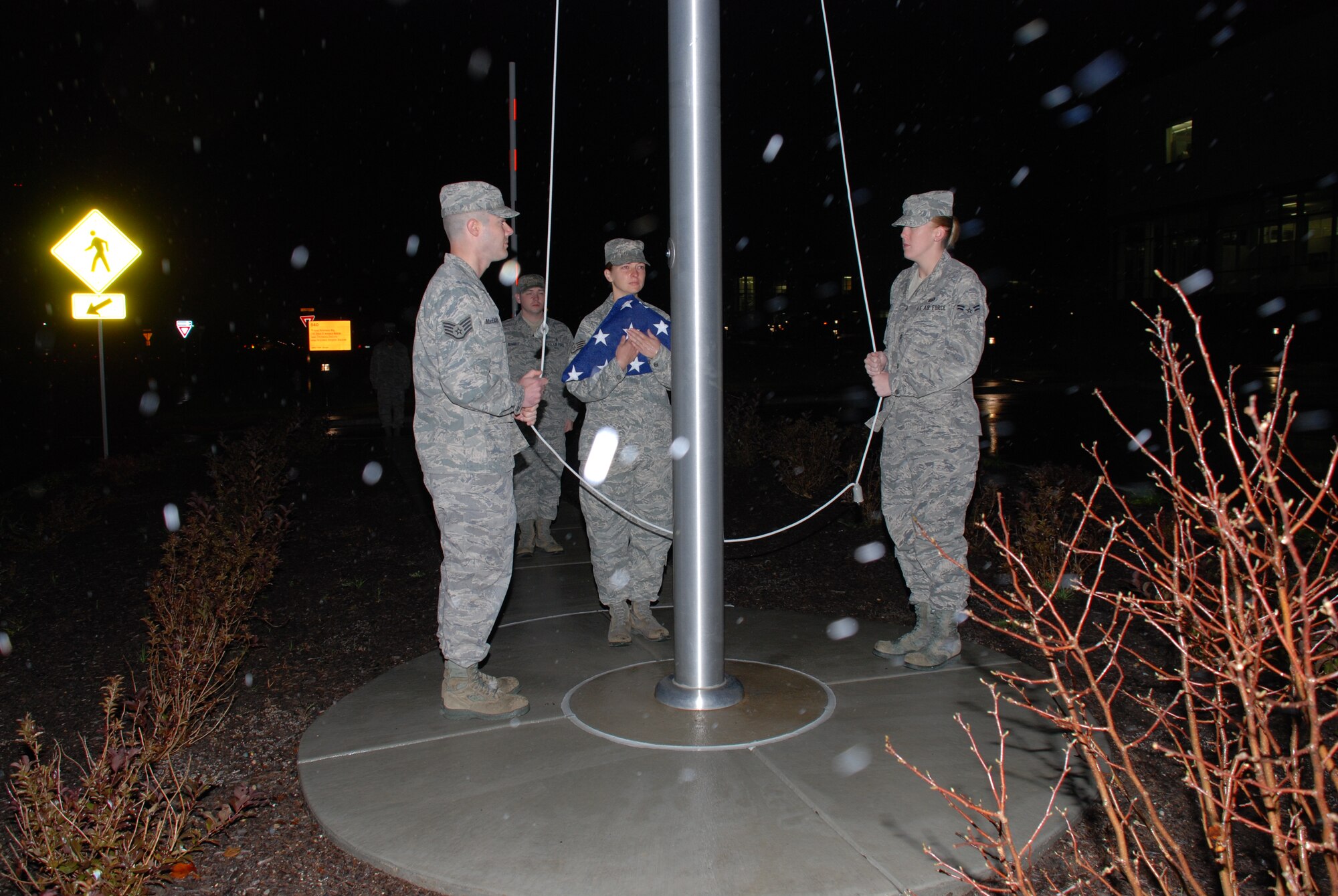 A flag detail consisting of instructors representing the various departments within USAFSAM took great care in handling the flag in other than ideal conditions on the October 20, 2011 flag pole dedication.