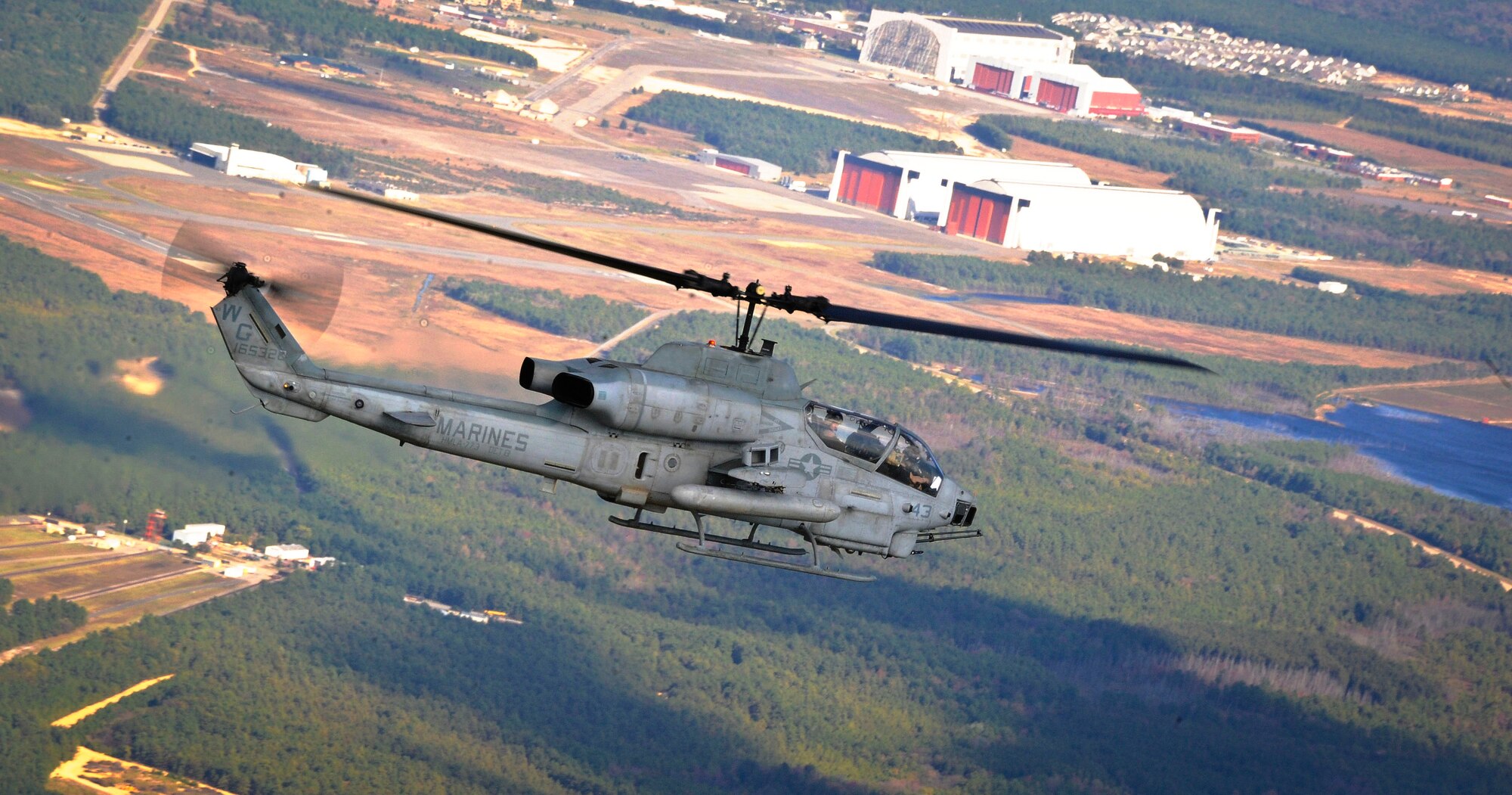 An AH-1W Super Cobra helicopter with Light Attack Helicopter Squadron 773 provides support during a Joint Tactical Recovery of Aircraft and Personnel exercise Oct. 15 here. The Joint TRAP exercise tested the Marines’ ability to recover downed-aircrew members behind enemy lines and return them to a safe location. Marines with the Marine Aircraft Group 49 organize, train and equip combat ready squadrons to augment and reinforce the active Marine forces in time of war, national emergency or contingency operations. (U.S. Air Force photo by Airman Ryan Throneberry/Released)