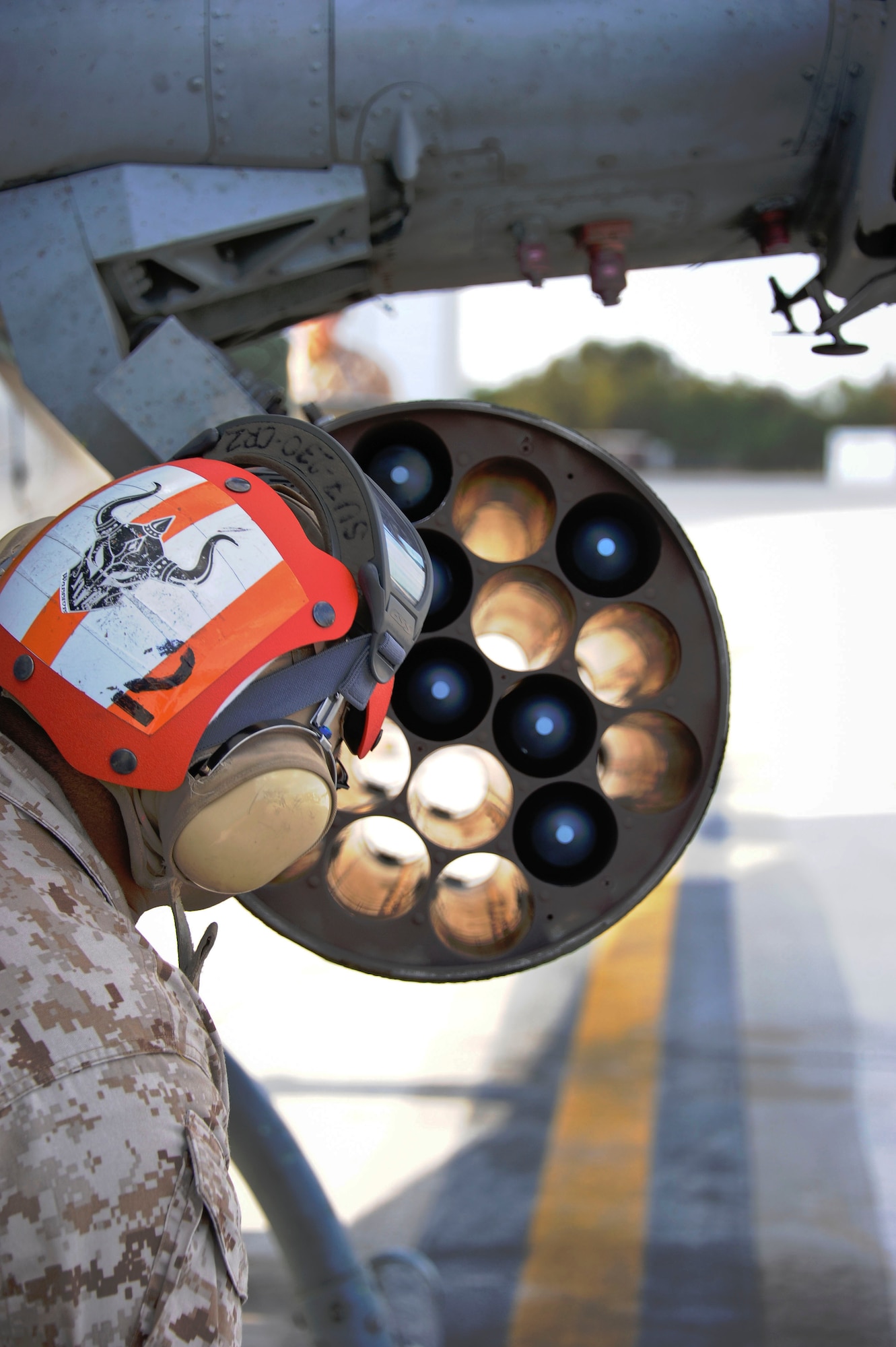 Staff Sgt. _____ Hernandez, a crew chief with the Marine Light Attack Helicopter Squadron 773, loads 2.75 inch inert rockets into the rocket pod of the AH-1W Super Cobra in preparation for the Joint Tactical Recovery of Aircraft and Personnel exercise Oct. 15 here. Marines with Marine Aircraft Group 49 organize, train and equip combat ready squadrons to augment and reinforce the active Marine forces in time of war, national emergency or contingency operations. (U.S. Air Force photo by Airman Ryan Throneberry/Released)