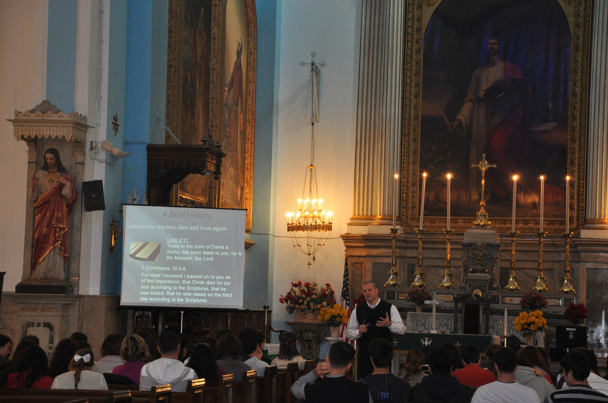 Chaplain (Capt.) Craig Forsythe, 425th Air Base Squadron, gives a briefing to a group of 62 American Collegiate Institute students accompanied by six teachers about the history of Christian religion, sacraments, religious sects and denominations at the Izmir Chapel Oct. 21, 2011, at Izmir, Turkey. The senior students of ACI visited the chapel with their teachers and administrators as part of their school project about the sacred sites and special places in Izmir. A separate group of 56 students and six teachers also visited Oct. 18. (U.S. Air Force photo by Tanju Varlikli/Released)