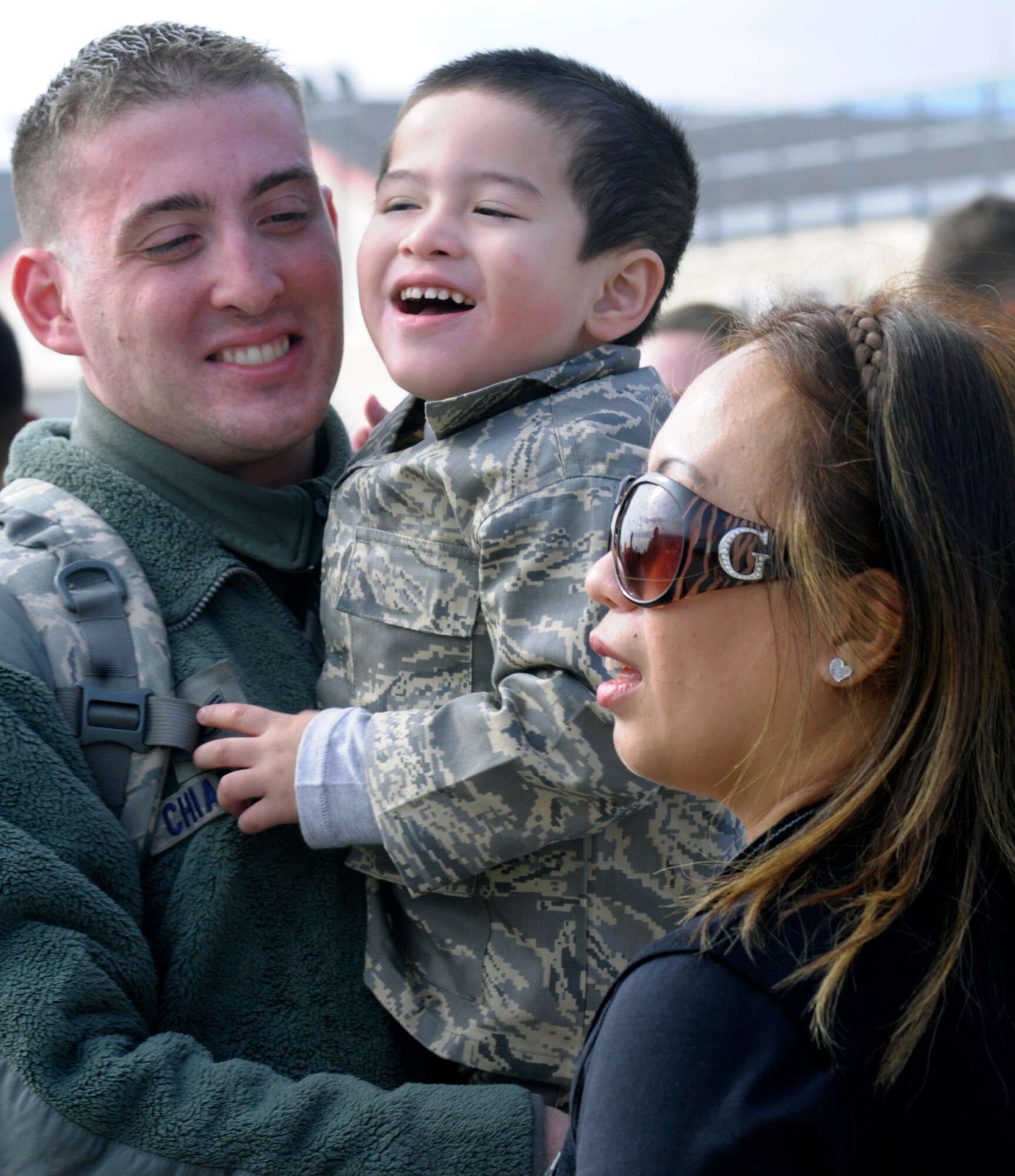 Staff Sgt. Anthony Chiapetta, 555th Fighter Squadron avionics systems craftsman, greets his son and wife Oct. 24 at Aviano Air Base, Italy. Chiapetta and other Airmen and civilians with the 555th Aviation Package received a warm welcome from families, friends and coworkers after returning from their six-month deployment to Afghanistan. (U.S. Air Force photo/Airman 1st Class Briana Jones)