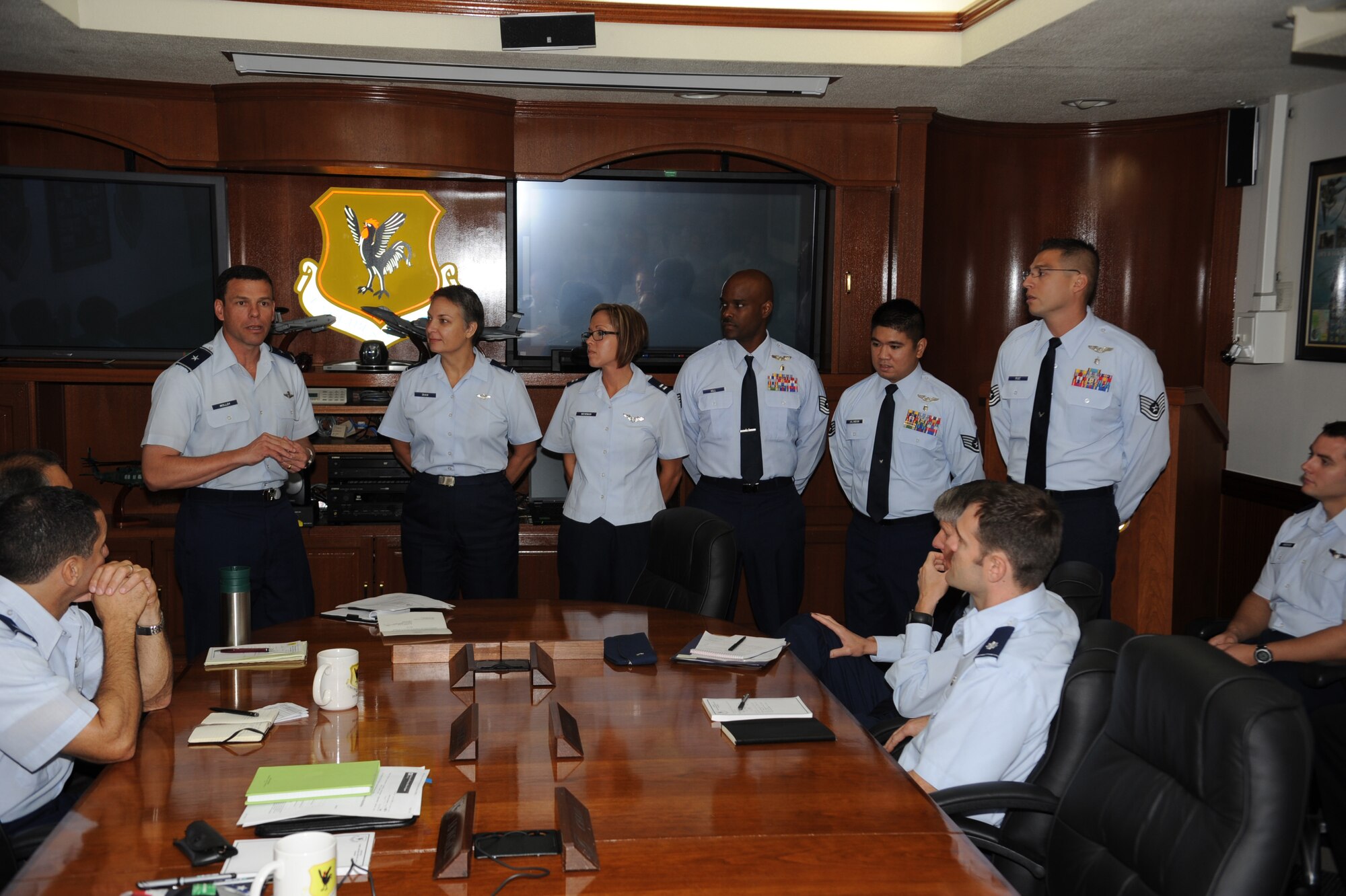 Brig. Gen. Matthew Molloy recognizes Lt. Col. Elizabeth Shaw, 18th Medical Group chief nurse; and four Airmen from the 18th Aeromedical Evacuation Squadron: Capt. Emily Newman, flight nurse; Tech. Sgt. Vidal Hill, training flight chief; Staff Sgt. Sean Jalandoni, AE technician; and Staff Sgt. Rigoberto Ruiz, aircrew training technician, for receiving the Lillian Keil Team Award with a commander's coin for each individual on Kadena Air Base, Japan, Oct. 17. The Lillian Keil Team Award recognizes a team making the most significant contributions to the mobility forces' AE mission during contingency operations. (U.S. Air Force photo/ Staff Sgt. Christopher Hummel/released)