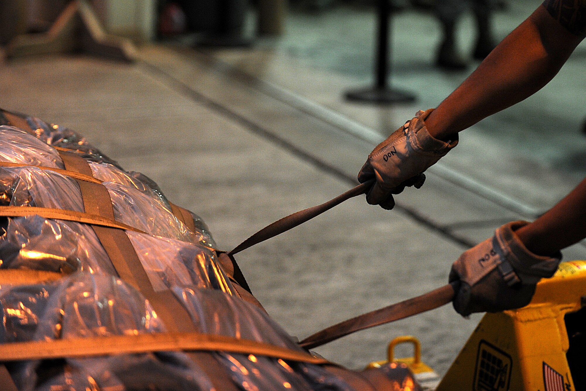 U.S. Air Force Airmen assigned to the 18th Logistics Readiness Squadron palletize baggage for simulated deployers during local operational readiness exercise Beverly High 12-1, Oct. 25, on Kadena Air Base, Japan. Beverly High is designed to test the operational readiness of Airmen assigned to Kadena Air Base.
(U.S. Air Force photo/Staff Sgt. Christopher Hummel/released)