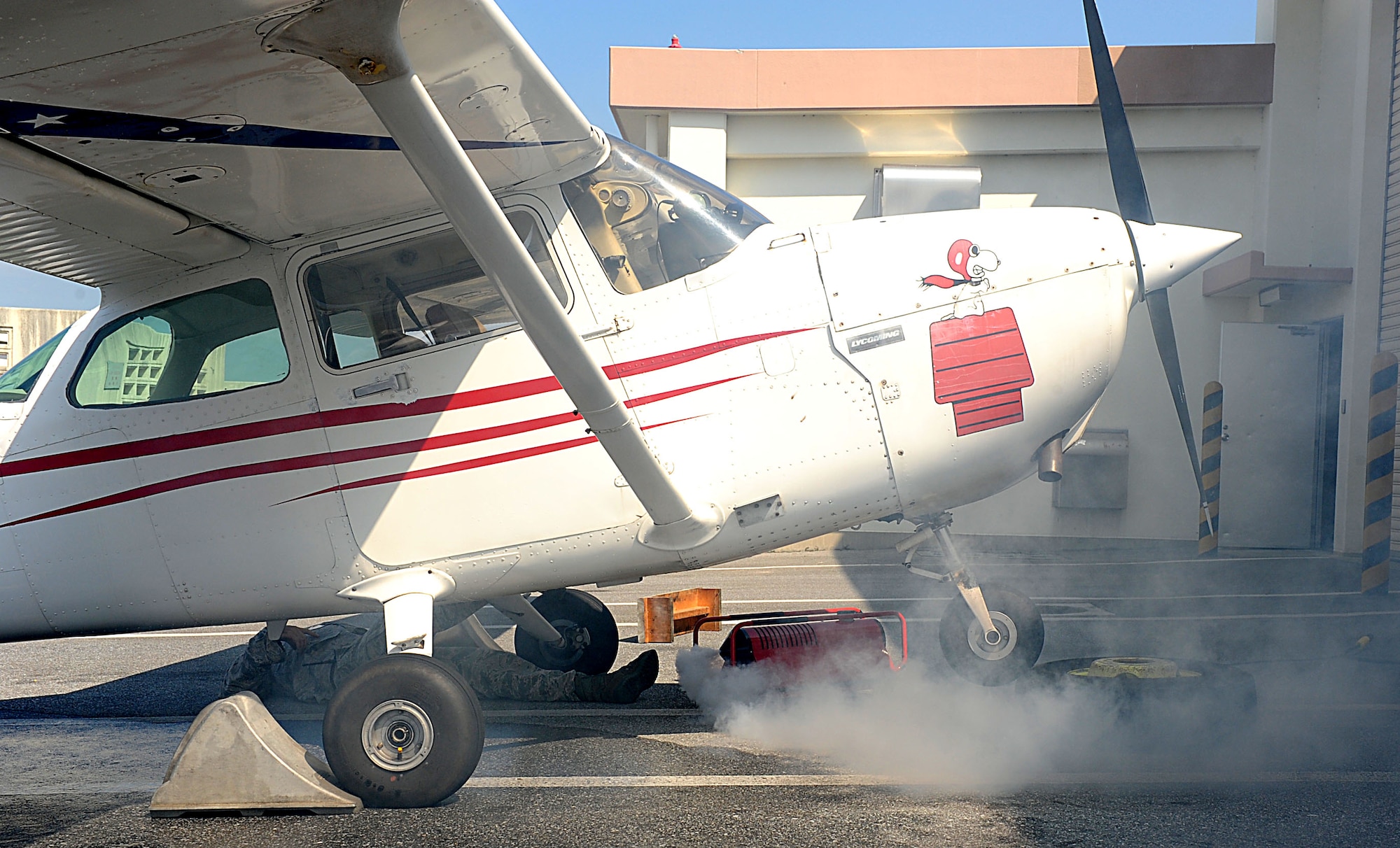 U.S. Air Force Master Sgt. Stephen Fairbanks, 18th Civil Engineer Squadron assistant chief of prevention, simulates being a victim of a plane crash during local operational readiness exercise Beverly High 12-1 on Kadena Air Base, Japan, Oct. 25. 18th CES firefighters responded to the scenario but left early due to a real-world fire response. (U.S Air Force photo/Airman 1st Class Brooke P. Beers/Released)