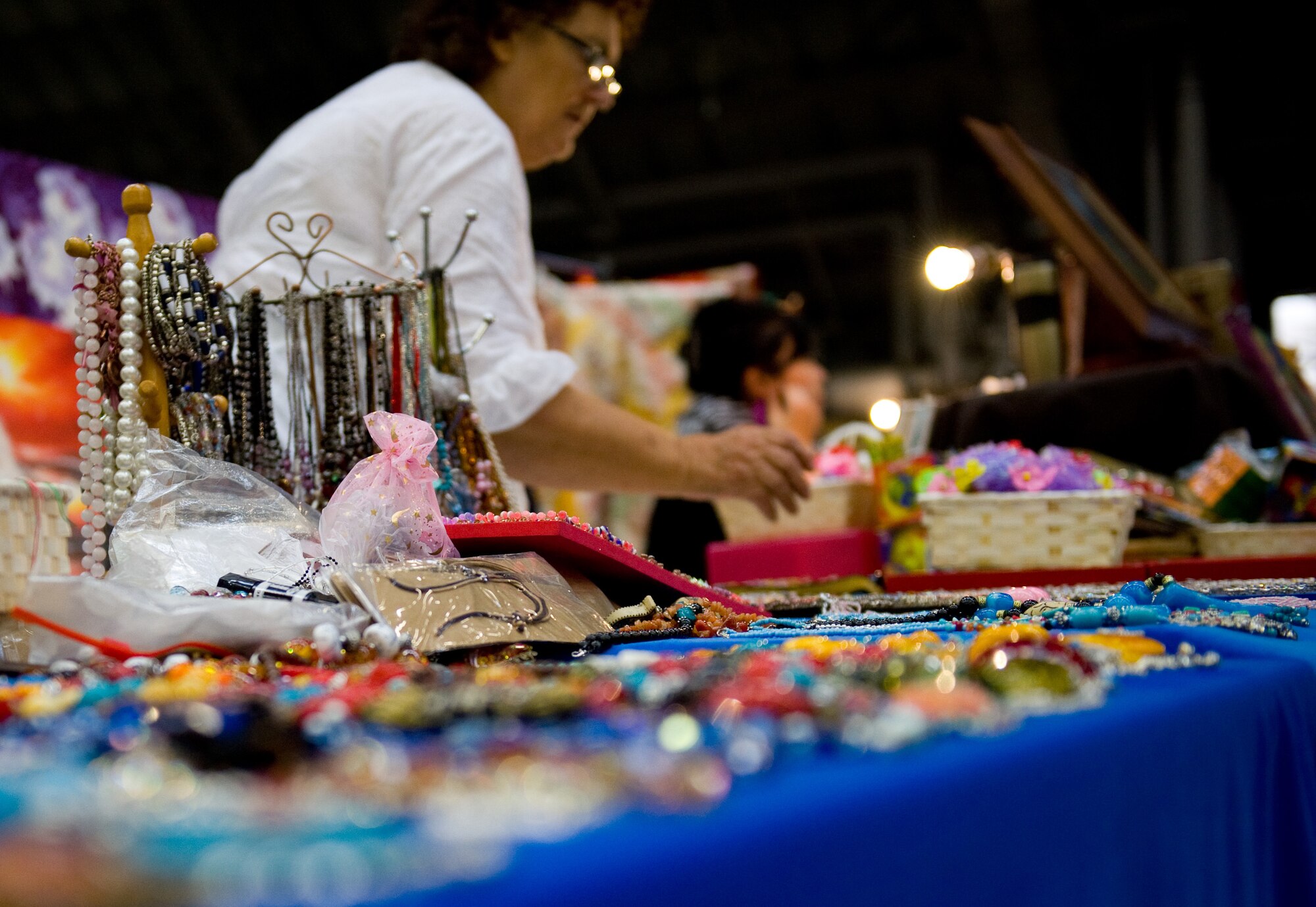 YOKOTA AIR BASE, Japan -- Gloria Askew, a vendor from London, sets up costume jewelry from Nepal to sell at the Yokota Officer Spouses Club Fall Bazaar at Yokota Air Base, Japan, Oct. 22, 2011. Products ranged from children's toys to jewelry. (U.S. Air Force photo/Airman 1st Class Krystal M. Garrett)  