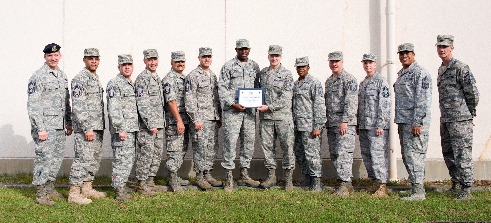 YOKOTA AIR BASE, Japan -- Airman 1st Class Larry Nation, 374th Communications Squadron network administration technician, is awarded the Sharp Troop Award from the Yokota Chiefs' Club at Yokota Air Base, Japan, Oct. 25, 2011. Nation is recognized for his communication support throughout the base. (U.S. Air Force photo/Airman 1st Class Krystal M. Garrett) 