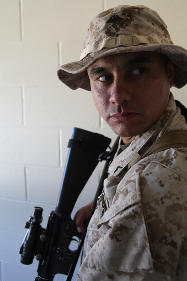 Private first class James Thompson , a rifleman with Charlie Company, 1st Battalion, 2nd Marine Regiment , posts security after clearing a room during the Motorized Raid Course Oct. 24, at Stone Bay's Home Station Lane Training complex here. The course took place Oct. 24 to Nov. 4 to prepare the company to serve as the 24th Marine Expeditionary Unit's motorized raid force.  Thompson is a native of Jacksonville, N.C.