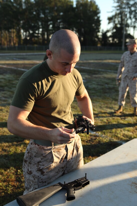 Cpl. Hector Luis Rodriguez, Jr. reassembles a M16A4 service rifle during the assembly and disassembly portion of the Headquarters and Support Battalion Commanders Cup Challenge field meet aboard Marine Corps Base Camp Lejeune, Oct. 26. The Company A Marines went undefeated in the tug-o-war portion of the meet, but still came in second place after Company B Marines pulled away from them in the finale.