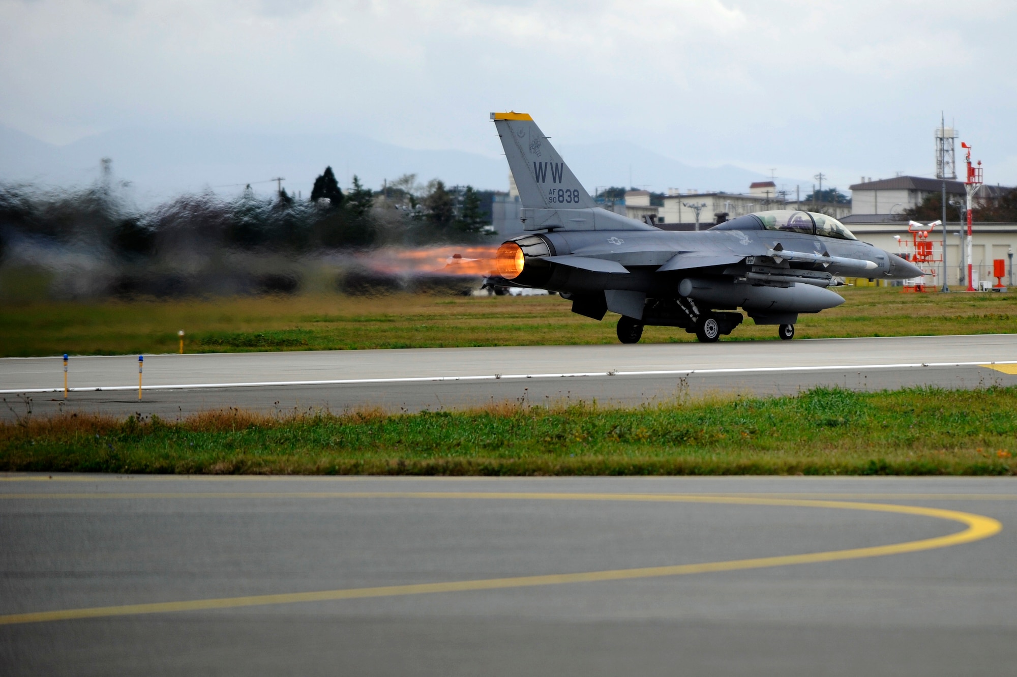 MISAWA AIR BASE, Japan - An F-16 Fighting Falcon takes off after their end-of-runway inspection here Oct. 26. The purpose of EOR is to arm the munitions on the jet and ensure it is safe to fly. (U.S. Air Force photo/Tech. Sgt. Marie Brown)