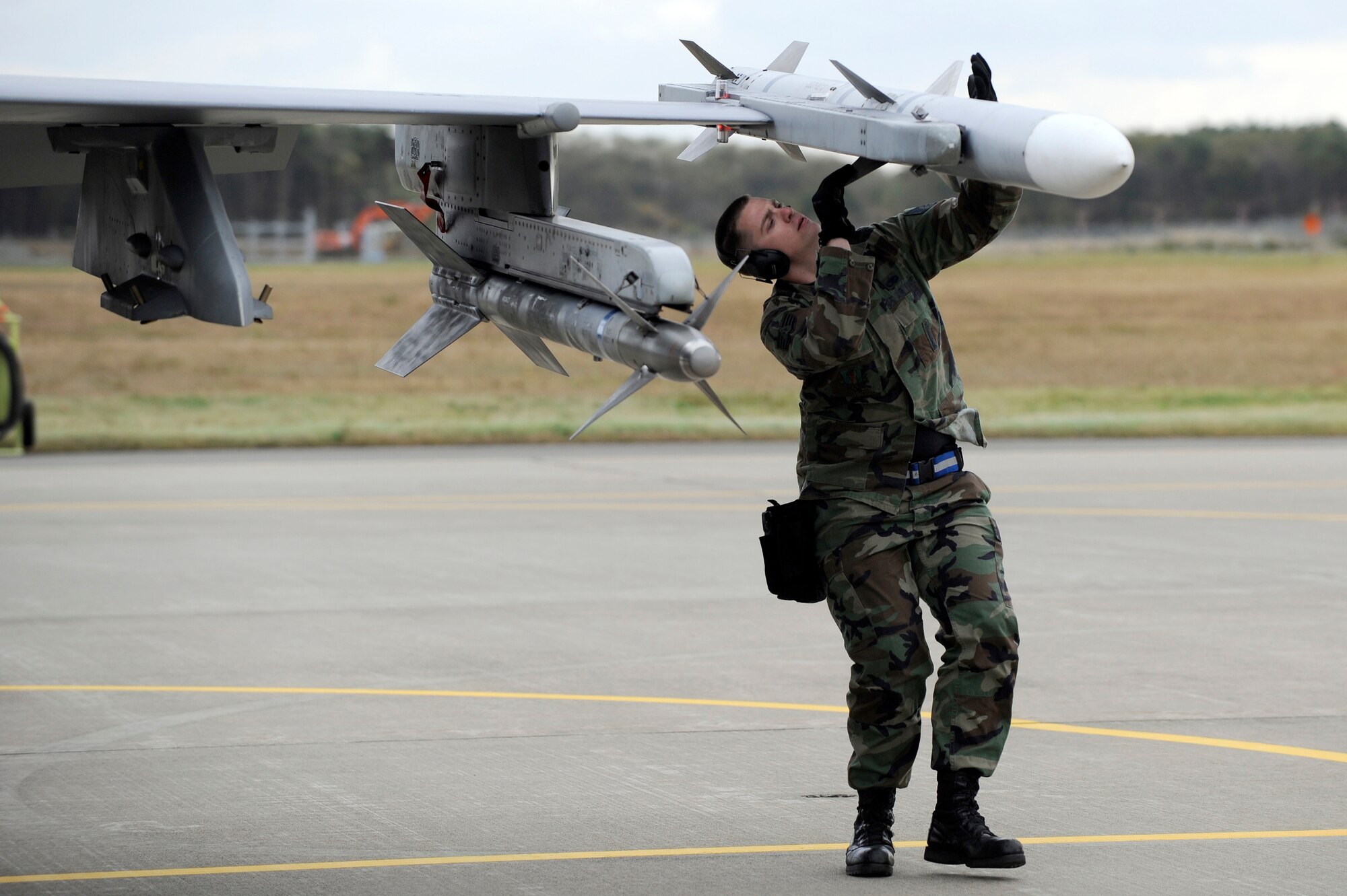 MISAWA AIR BASE, Japan - U.S. Air Force Staff Sgt. Daniel Butzin, 14th Aircraft Maintenance Unit, completes final checks on an F-16 Fighting Falcon during the end-of-runway inspection here Oct. 26. The purpose of EOR is to arm the munitions on the jet and ensure it is safe to fly. (U.S. Air Force photo/Tech. Sgt. Marie Brown)