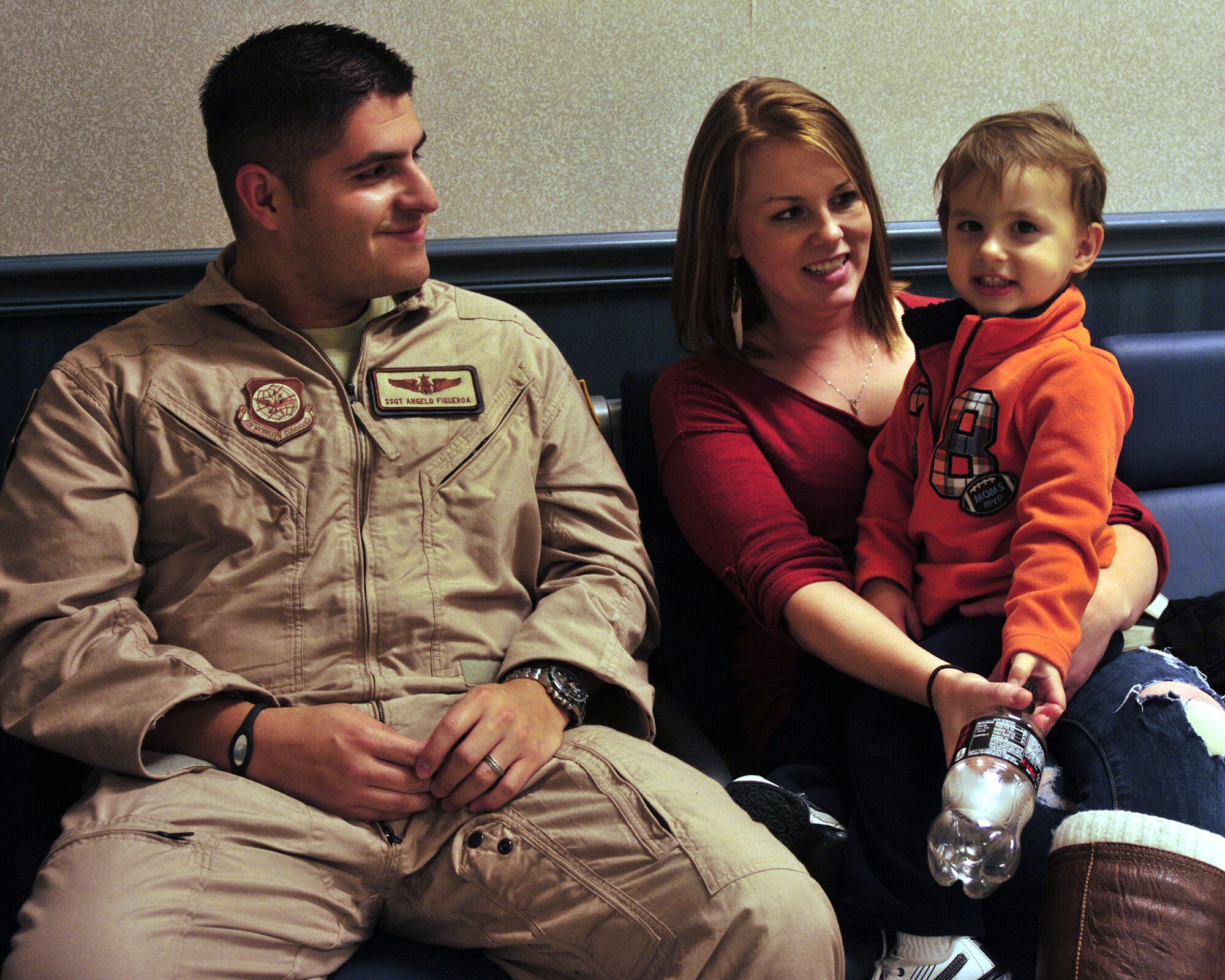 Staff Sgt. Angelo Figueroa, 4th Airlift Squadron loadmaster, spends time with his wife, Kristine, and son, Jayce, prior to his deployment Oct. 25, 2011, at Joint Base Lewis-McChord, Wash. The 4th AS will be deployed for 60 days to the Middle East. (U.S. Air Force photo/Staff Sgt. Frances Kriss)