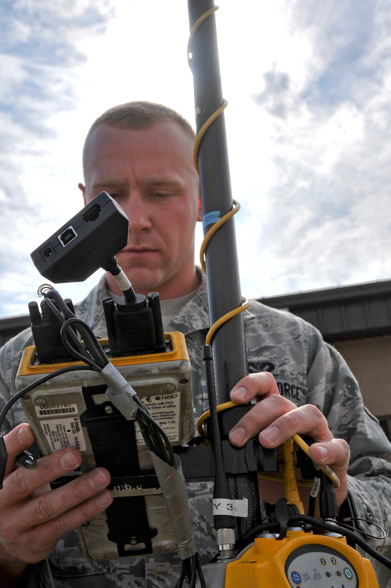 Airman 1st Class Richard Kuhn, 51st Civil Engineer Squadron engineering apprentice, uses a Rover during the Emergency Management Exercise Oct. 21, 2011. The Rover is used to mark geographical pints which can then be made into a map of an area. (U.S. Air Force photo/Senior Airman Adam Grant)