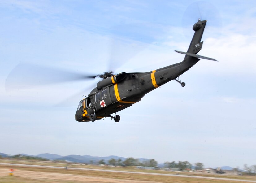 A UH-60 Black Hawk takes off after having casualties loaded during the Emergency Management Exercise Oct. 21, 2011. This portions of the exercise tested member’s ability to coordinate air medical evacuation with the Army.  (U.S. Air Force photo/Senior Airman Adam Grant)