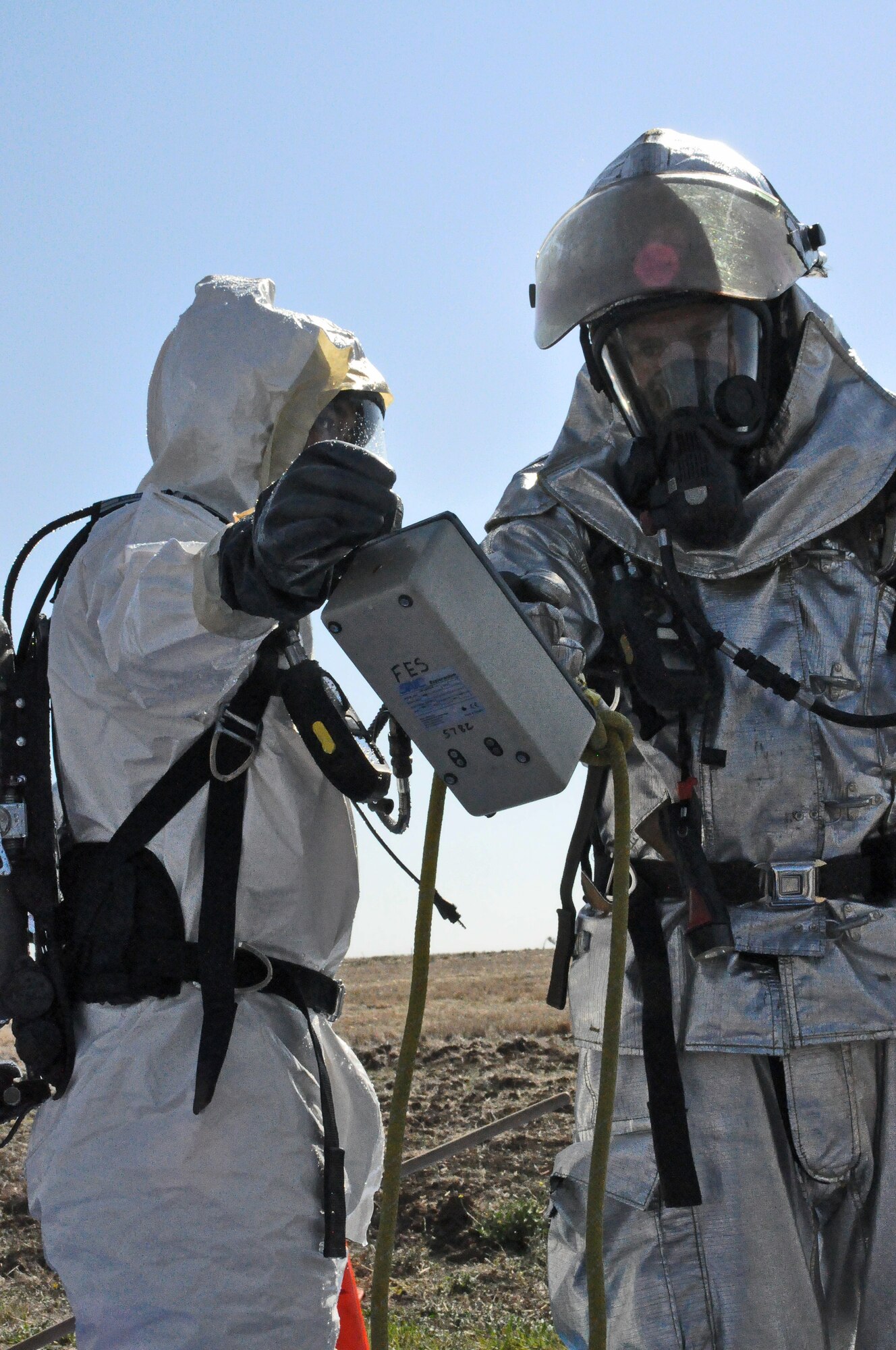 Staff Sgt. Ronald Cruz, 60th Medical Group bioenvironmental is checked for hazardous material by fire and emergency after the decontamination process Oct. 20 during a Task Force exercise. (U.S. Air Force photo/ Airman Madelyn Ottem)