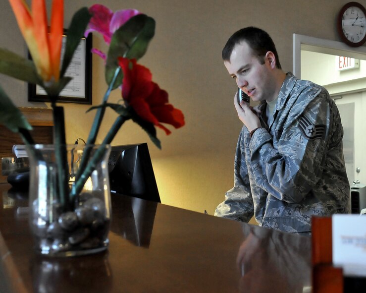 Staff Sgt. Cliff Kaldveer, 9th Force Support Squadron guest service representative, updates reservations at the Gold Country Inn on Beale Air Force Base, Calif., October 19, 2011. The Gold Country Inn provides twenty-four hour service for Beale Airmen who reside in lodging and the dormitories. (U.S. Air Force photo by Airman 1st Class Rebeccah Anderson)