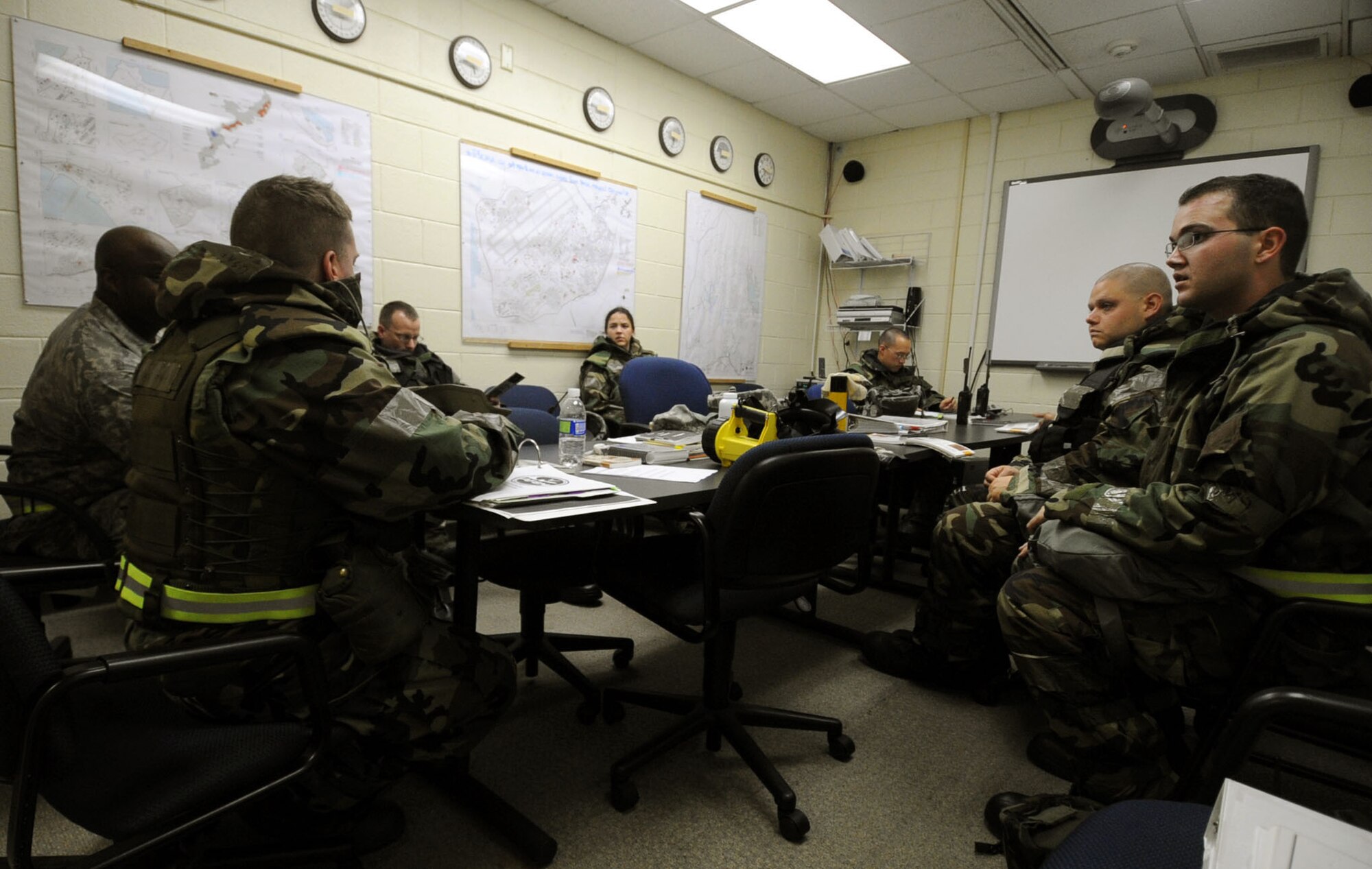 Members of the 18th Aerospace Medicine Squadron, Bio Environmental Engineering discuss their performance after performing a PAR sweep, or post attack reconnaissance sweep during Beverly High 12-1, a local operational readiness exercise at Kadena Air Base, Japan, Oct. 27. The exercise tested the wing's ability to deploy and receive forces as well as generate sorties. (U.S. Air Force photo/Senior Airman Sara Csurilla/released)