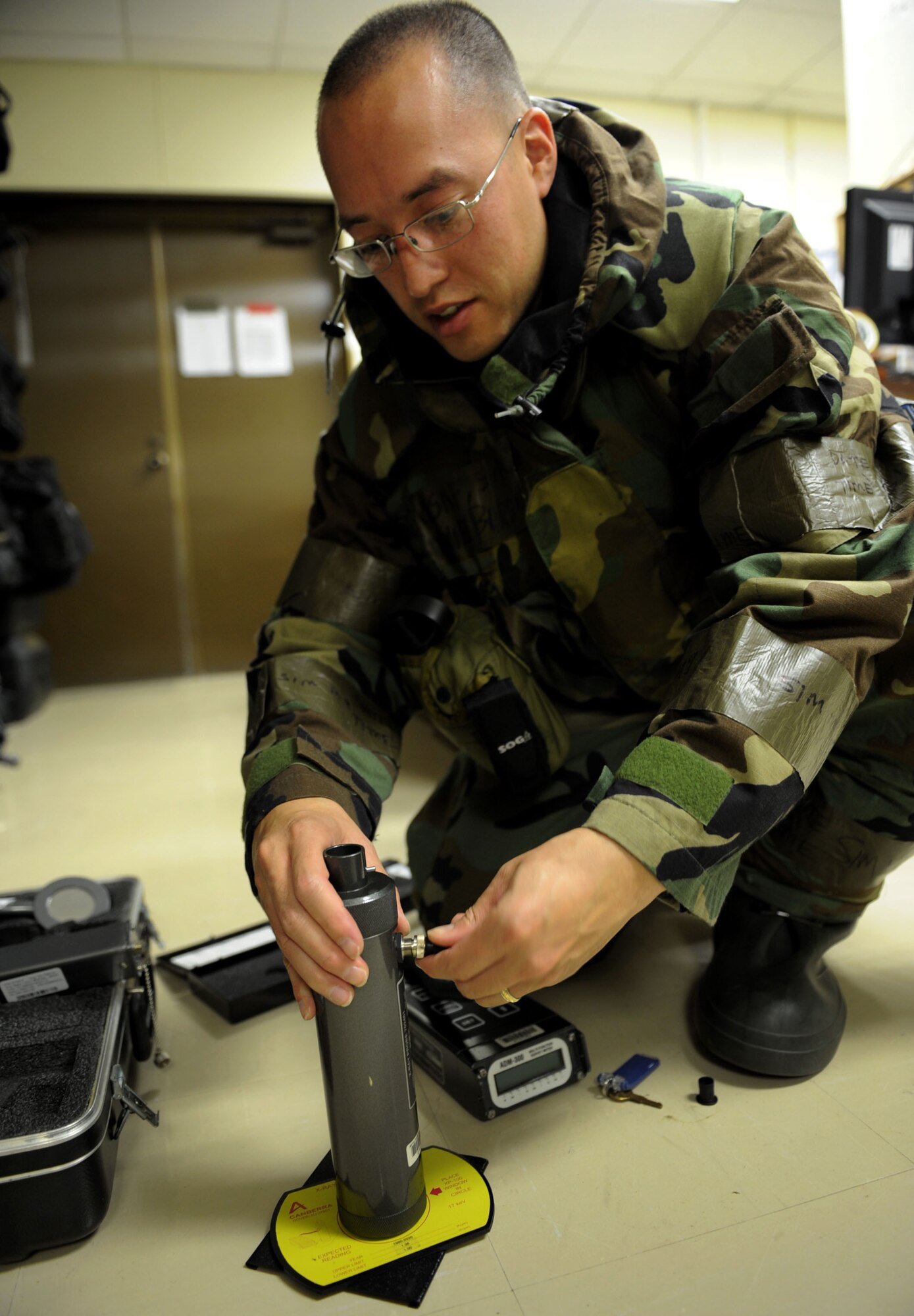 Senior Airman Daniel Burdick, 18th Aerospace Medicine Squadron Bio Environmental Engineering technician, checks M-256 packets, used to detect chemical agents, to ensure they are in good condition during Beverly High 12-1, a local operational readiness exercise at Kadena Air Base, Japan, Oct. 27. During LOREs members of Bio Environmental Engineering do daily equipment checks so they know the condition of all their equipment in case they are needed in any type of scenario during the LORE. The exercise tested the wing's ability to deploy and receive forces as well as generate sorties. (US Air Force photo/Senior Airman Sara Csurilla)