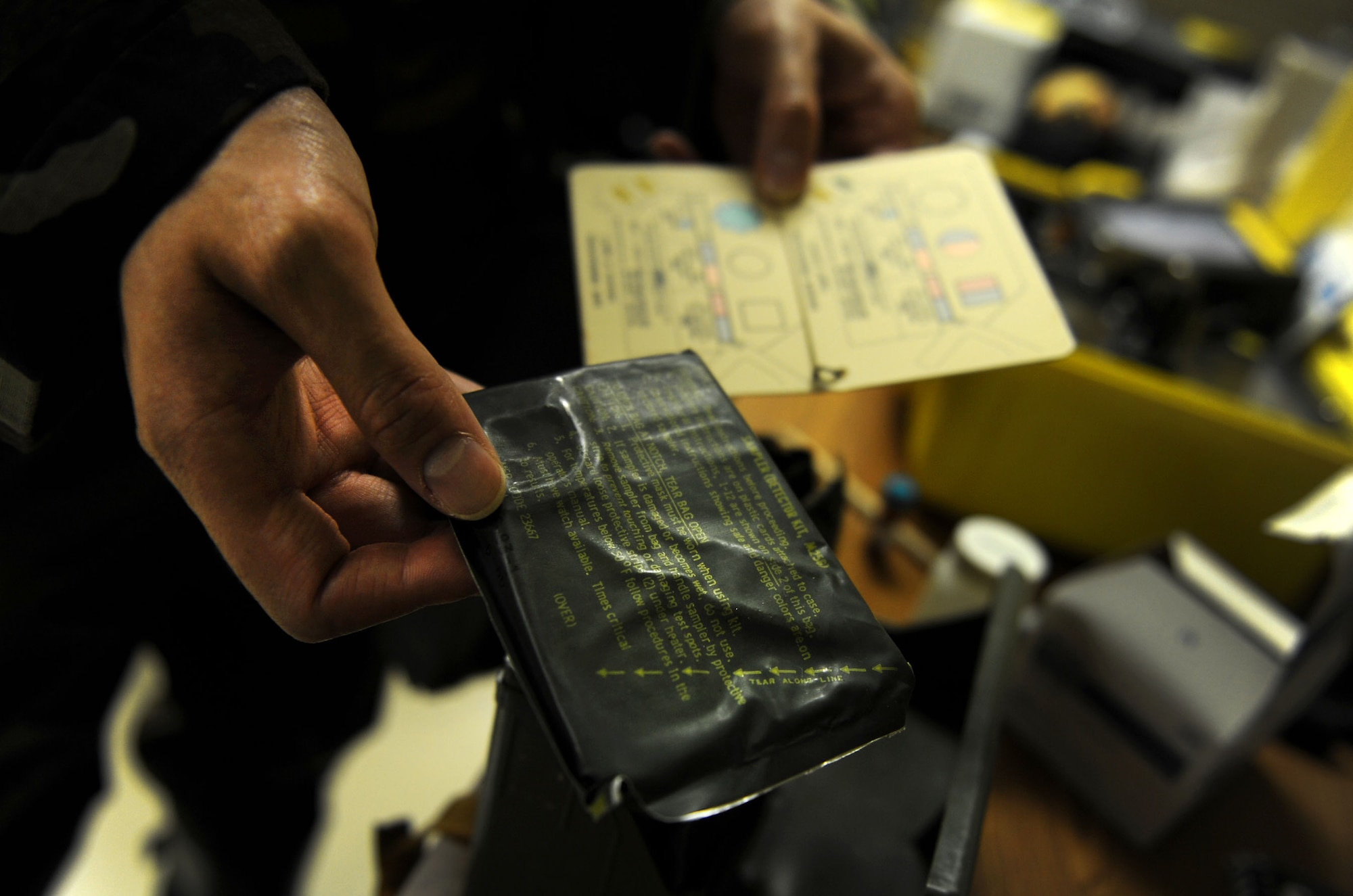 Senior Airman Daniel Burdick, 18th Aerospace Medicine Squadron Bio Environmental Engineering technician, checks an ADM-300, a piece of equipment Bio Environmental Engineering techs use to survey and detect radiation, to ensure it's in working condition during Beverly High 12-1, a local operational readiness exercise at Kadena Air Base, Japan, Oct. 27. During LOREs members of Bio Environmental Engineering do daily equipment checks so they know the condition of all their equipment in case they are needed in any type of scenario during the LORE. The exercise tested the Wing's ability to deploy and receive forces as well as generate sorties. (US Air Force photo/Senior Airman Sara Csurilla)