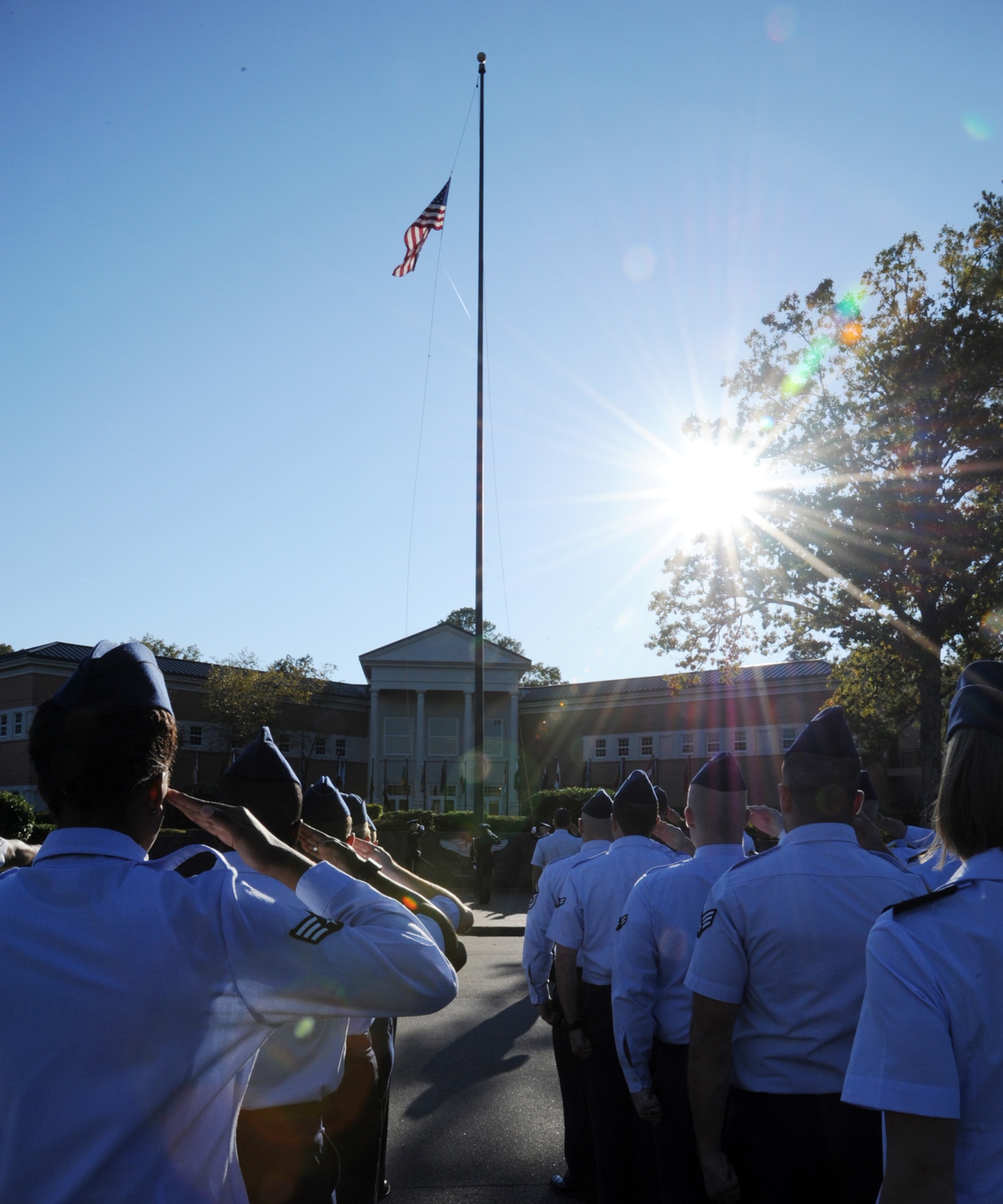 Members of the 14th Flying Training Wing salute the American Flag during a
retreat ceremony on Oct. 25 in Smith Plaza. The sounding of Retreat traditionally ignals the end of the duty day. (U.S. Air Force photo/Airman 1st Class Chase Hedrick)